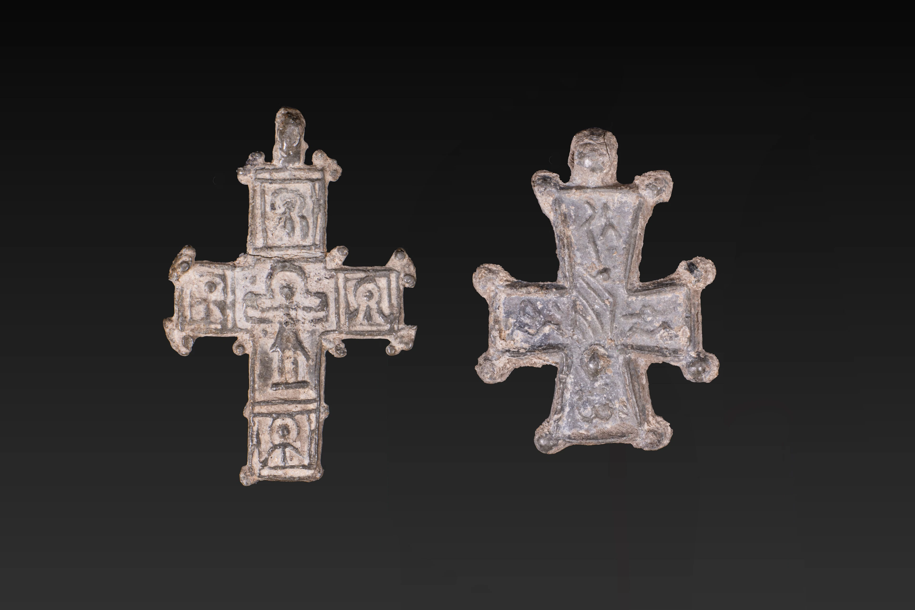 PAIR OF BYZANTINE LEAD CROSS PENDANTS