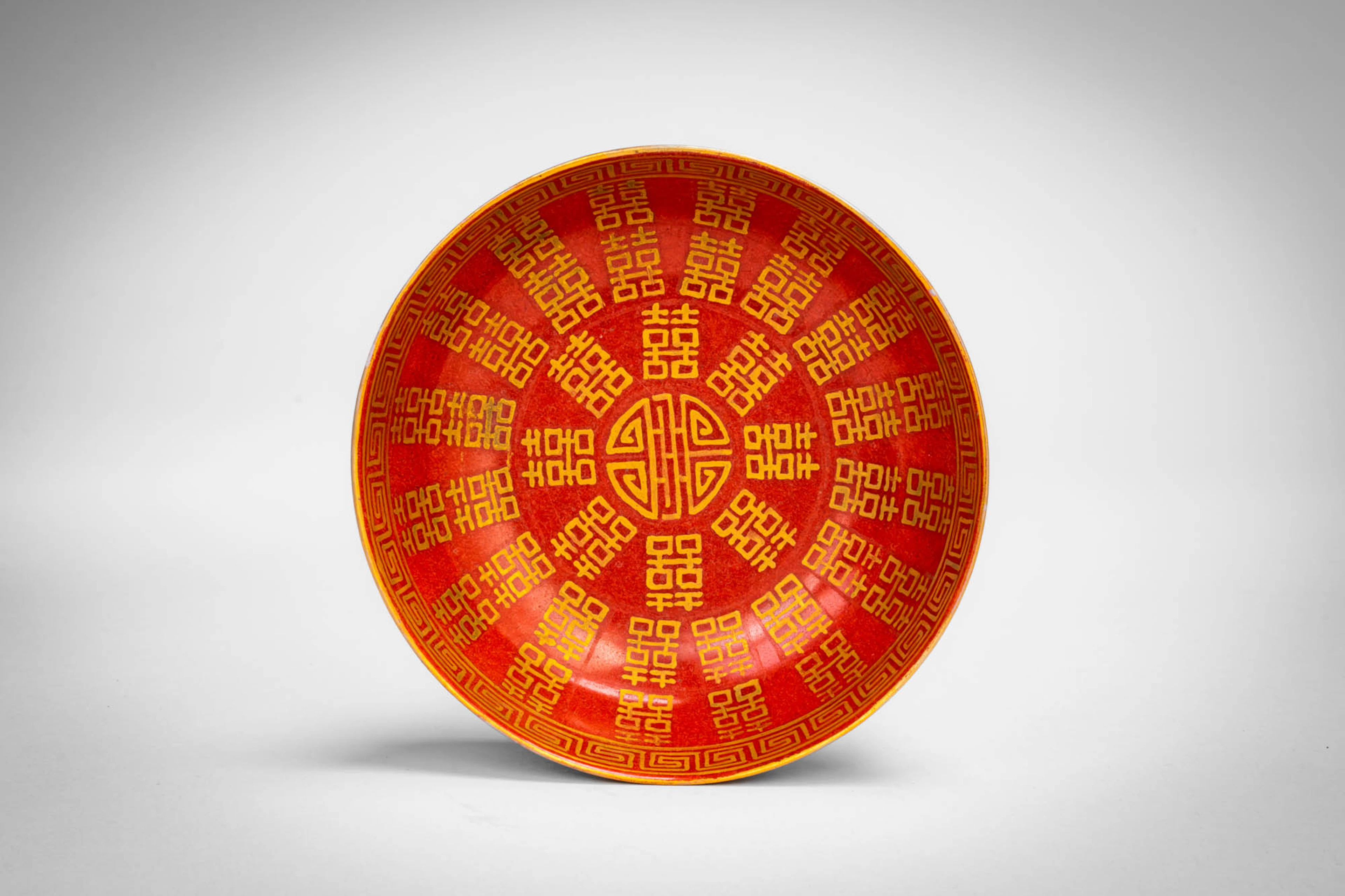 CHINESE IRON-RED GILT-DECORATED 'MARRIAGE' DISH, CHANG CHUN TONG QING MARK 長春同慶