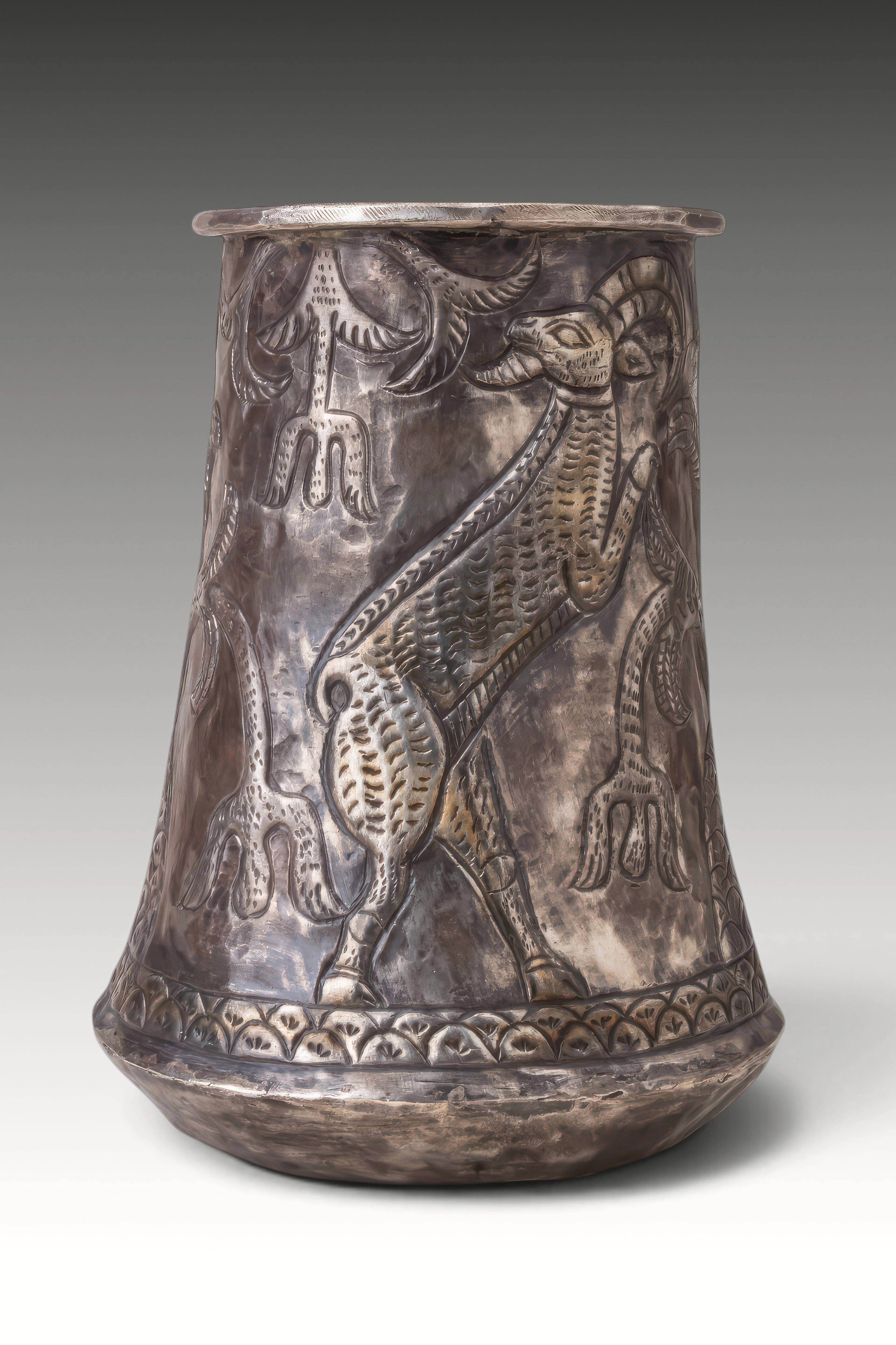 RARE ELAMITE SILVER-GILT BEAKER WITH TREE OF LIFE FLANKED BY RAMPANT STAGS