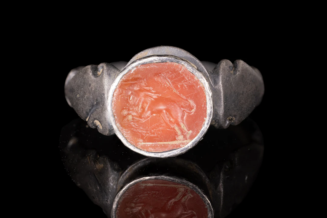 ROMAN CARNELIAN INTAGLIO WITH RAMPANT LION IN SILVER RING