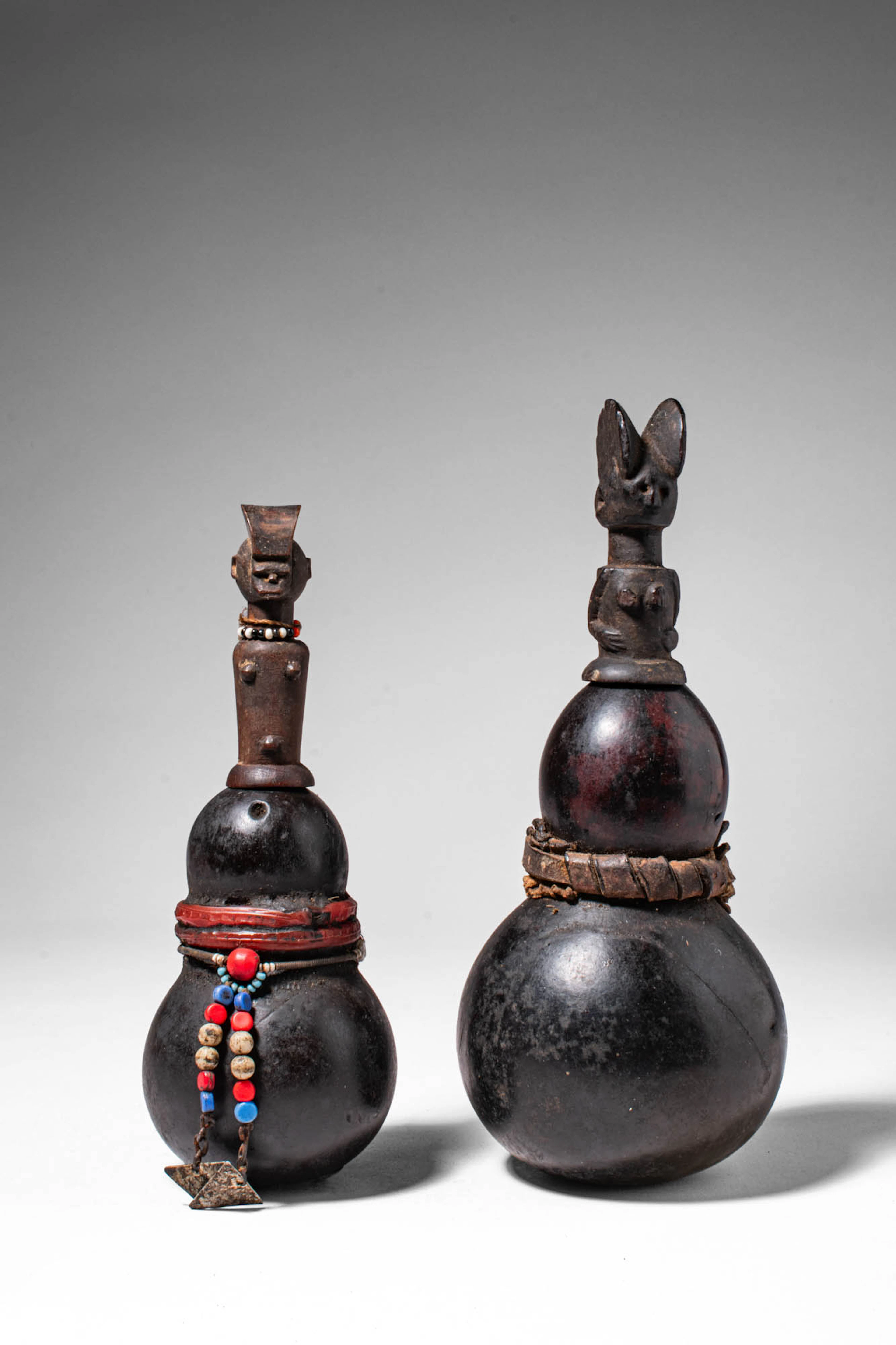 PAIR OF TANZANIAN KWERE CALABASH VESSELS WITH FIGURATIVE STOPPERS