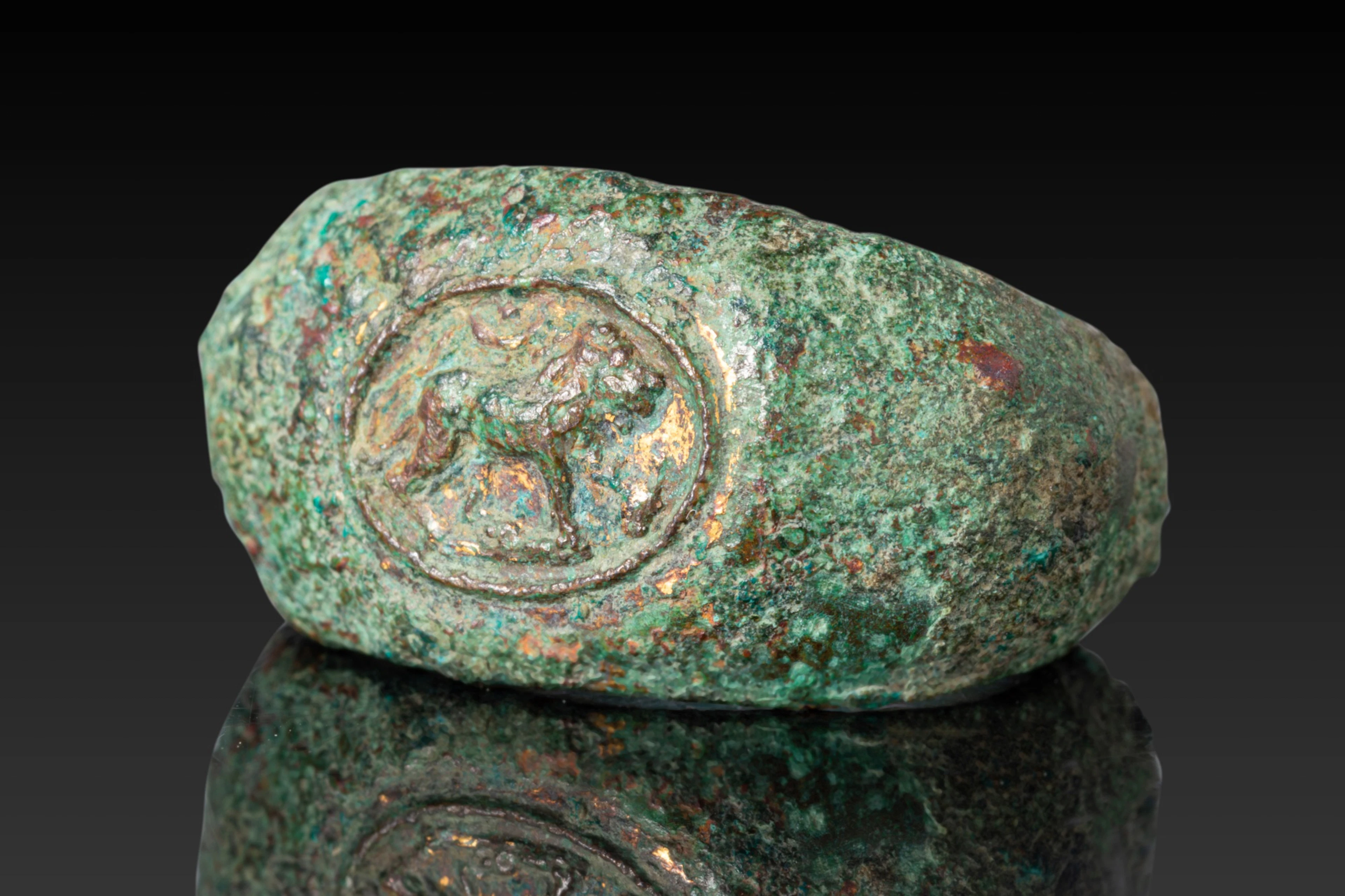 GRAECO-ROMAN BRONZE RING WITH LION, CRESCENT AND STAR