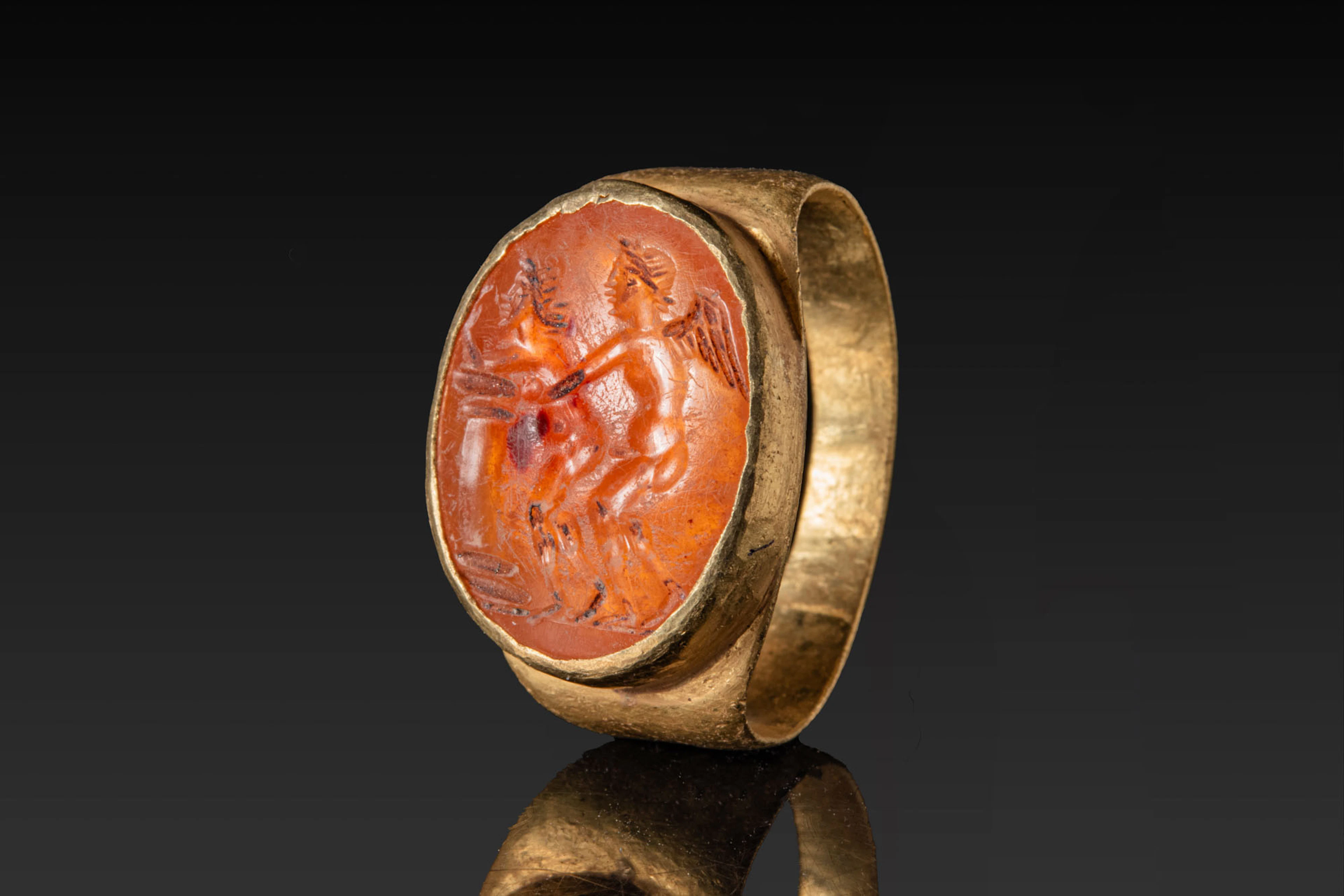 ROMAN CARNELIAN INTAGLIO WITH EROTIC SCENE IN GOLD RING