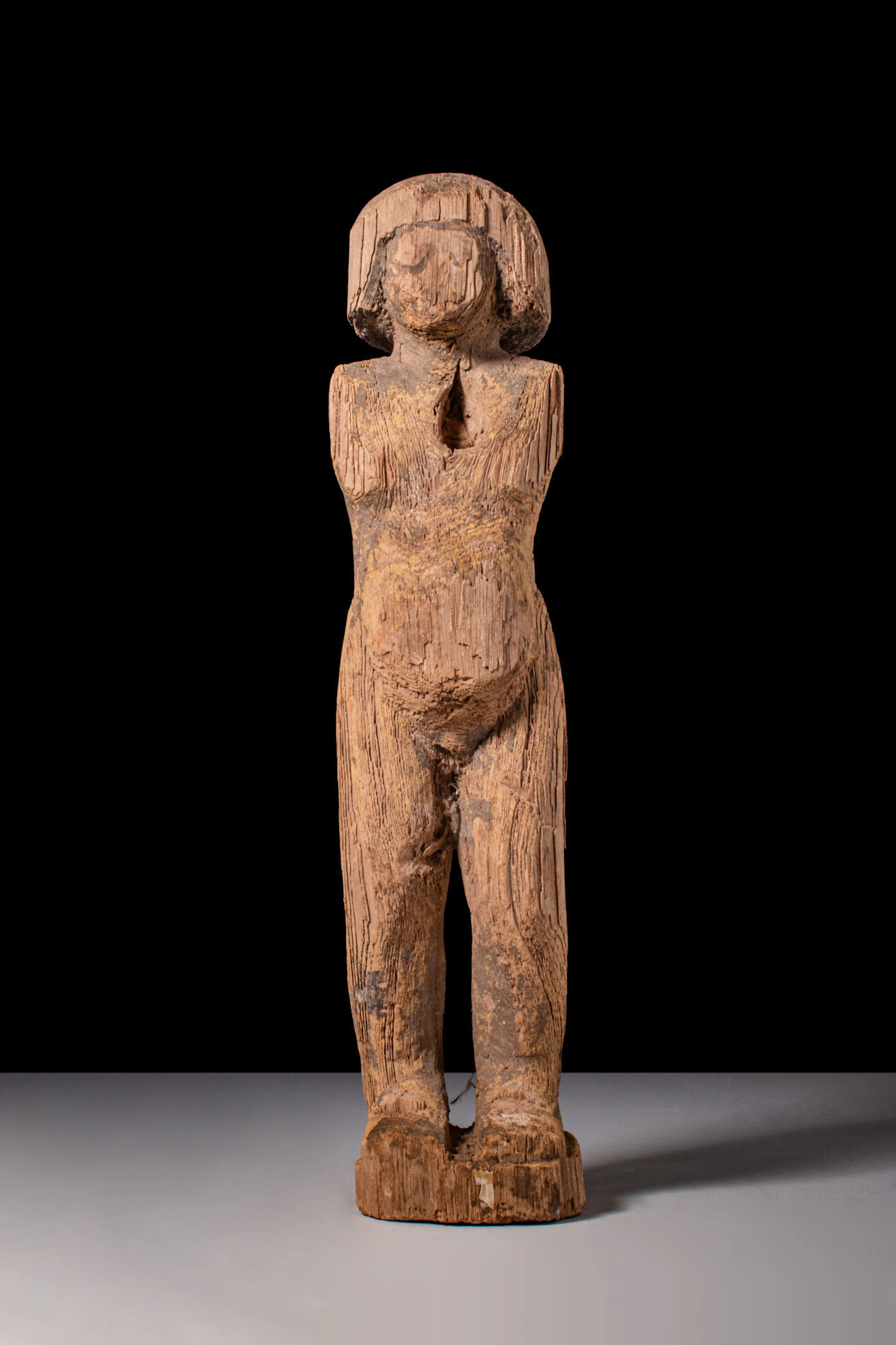 EGYPTIAN WOODEN STATUETTE OF A ROWER
