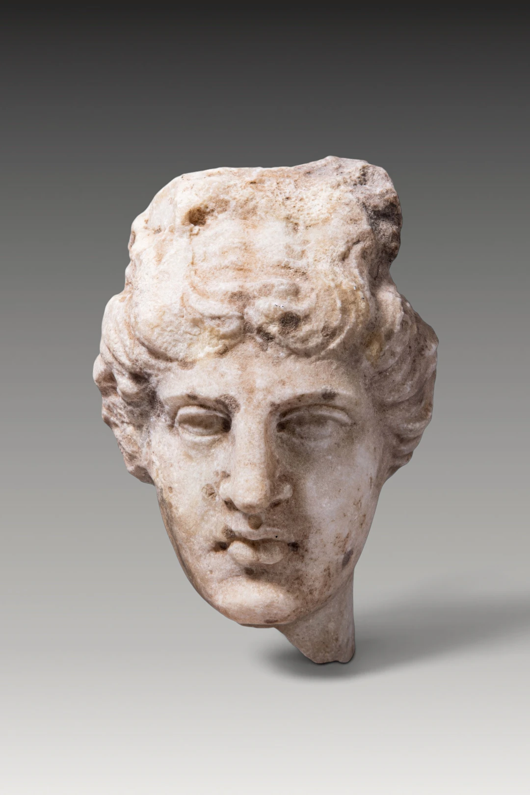 EASTERN ROMAN MARBLE HEAD OF APOLLO BELVEDERE TYPE