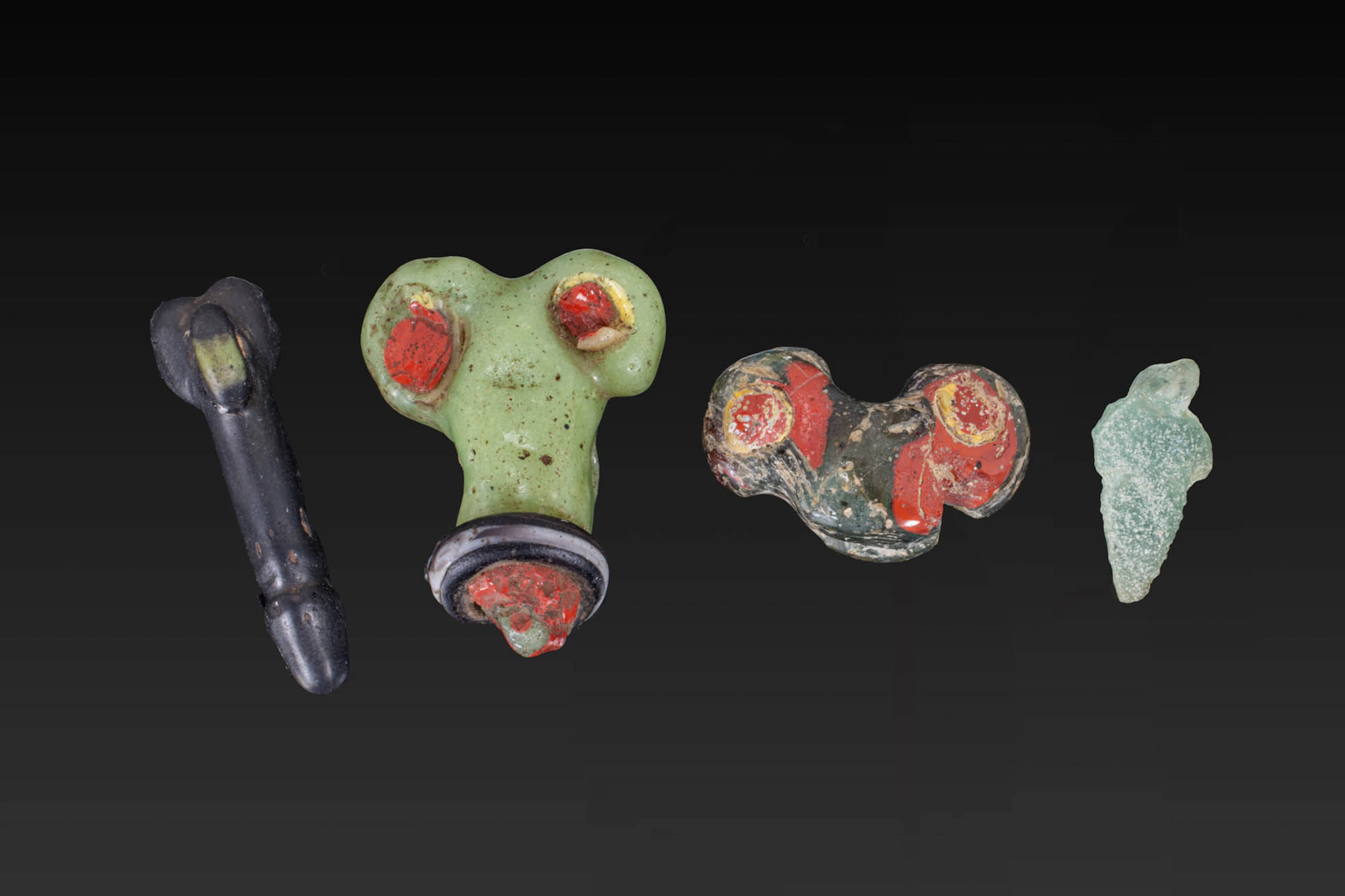 COLLECTION OF GRAECO-ROMAN GLASS PHALLUS-SHAPED AMULETS