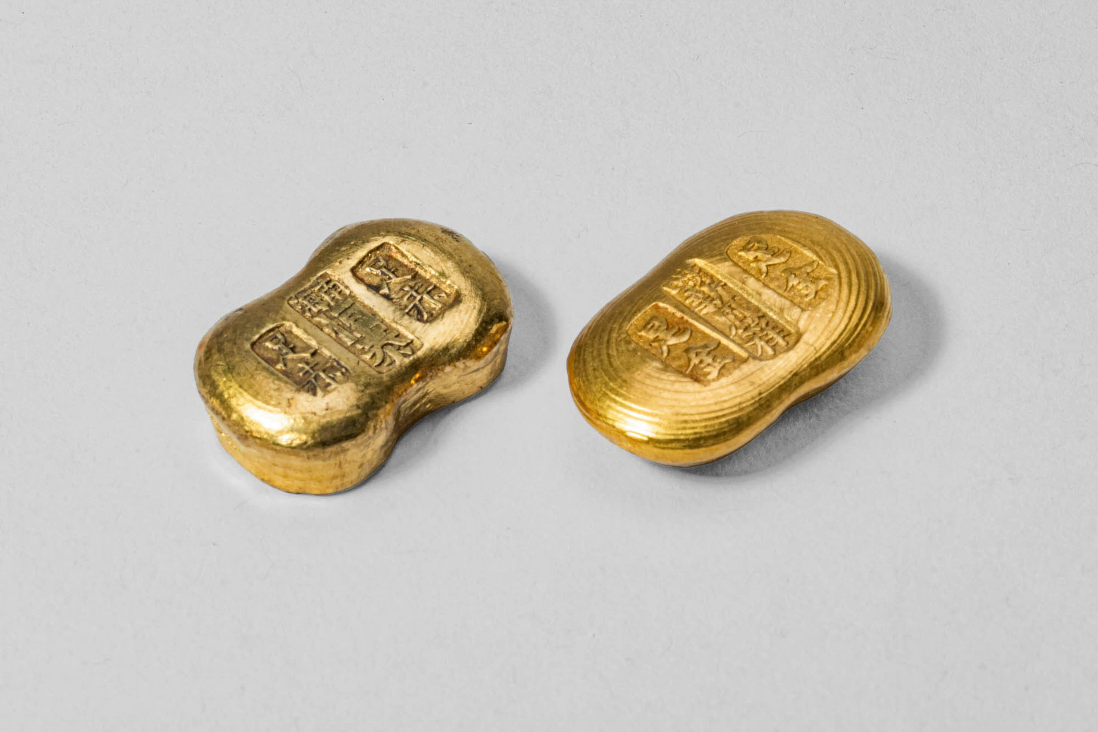 TWO CHINESE GOLD PEANUT INGOTS, 62.5 GRAMS