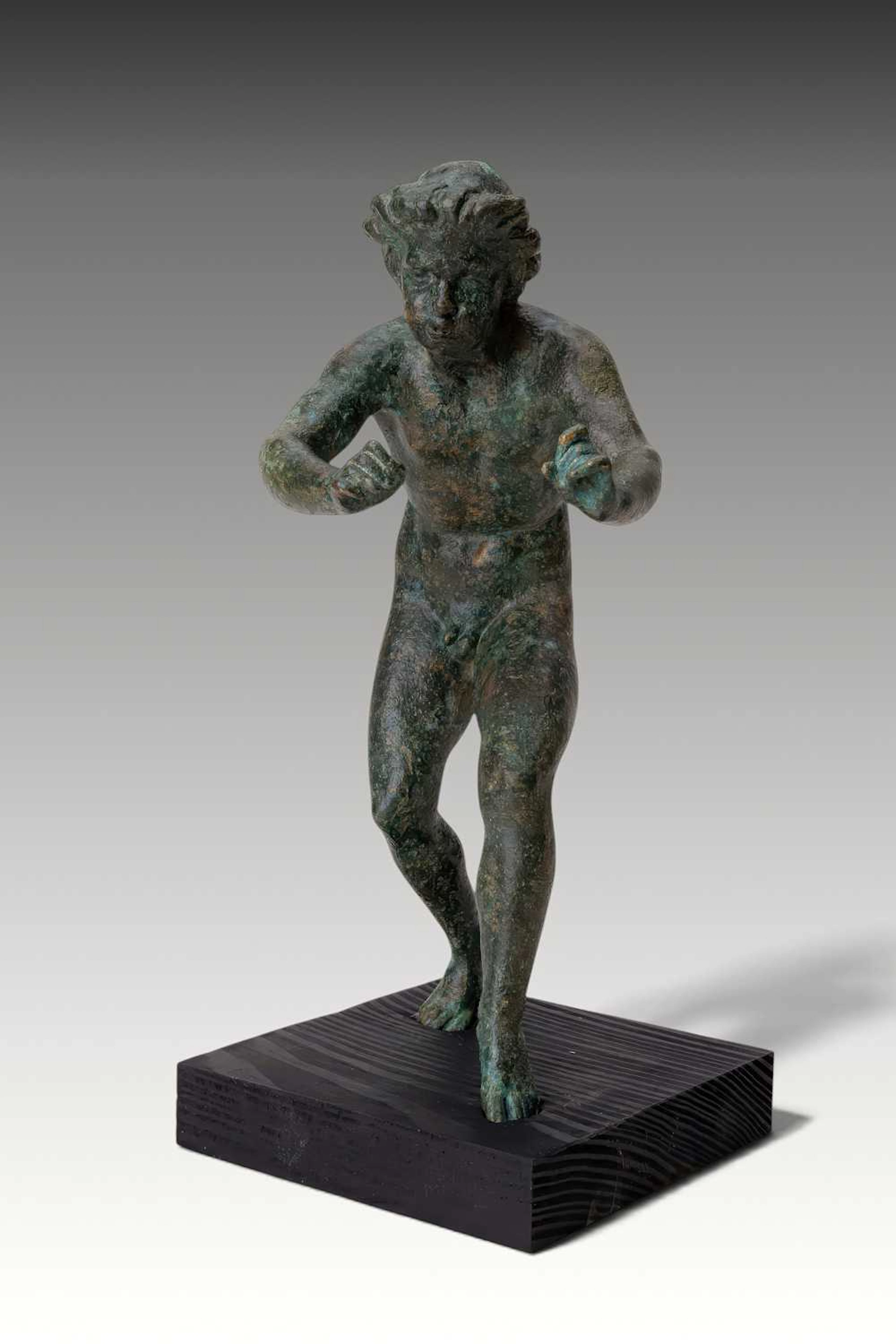 RARE ROMAN BRONZE FIGURINE OF A MUSICIAN PLAYING A FLUTE