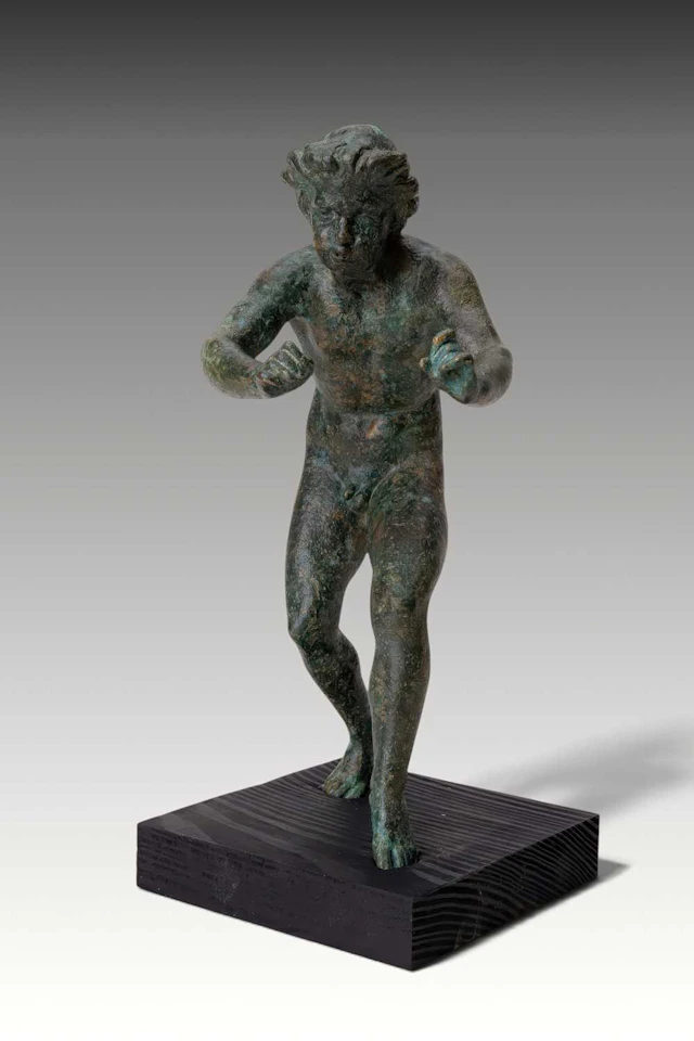 RARE ROMAN BRONZE FIGURINE OF A MUSICIAN PLAYING A FLUTE