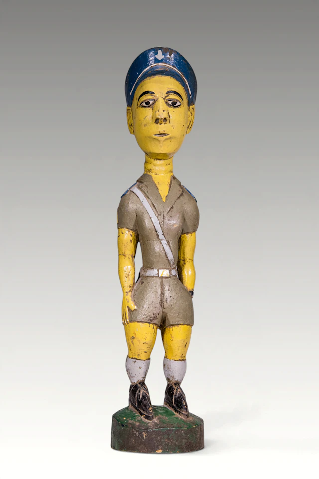 BAULE PAINTED FIGURE OF COLONIAL POLICEMAN