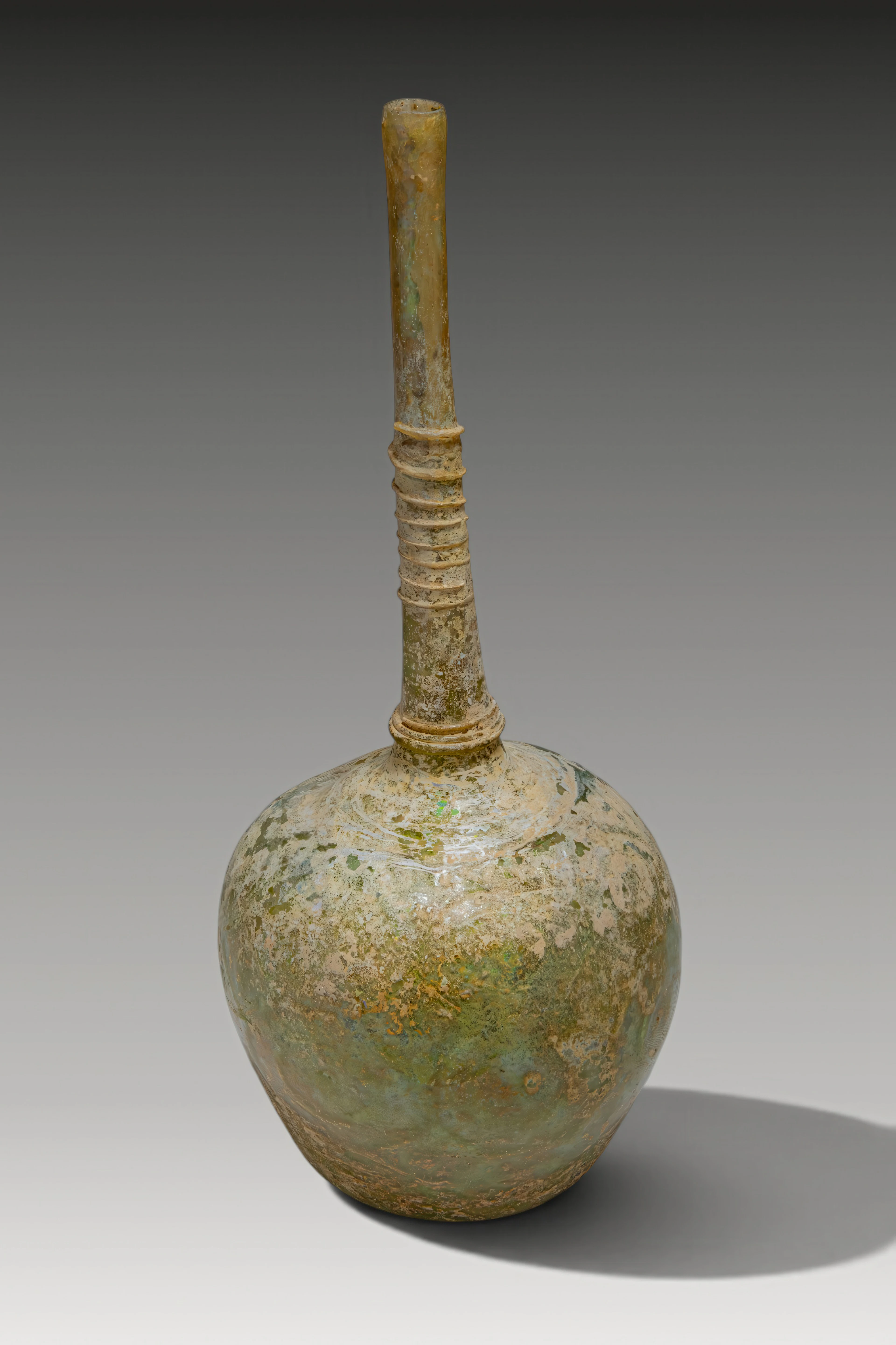UMAYYAD GLASS BOTTLE WITH GLASS THREAD DECORATION