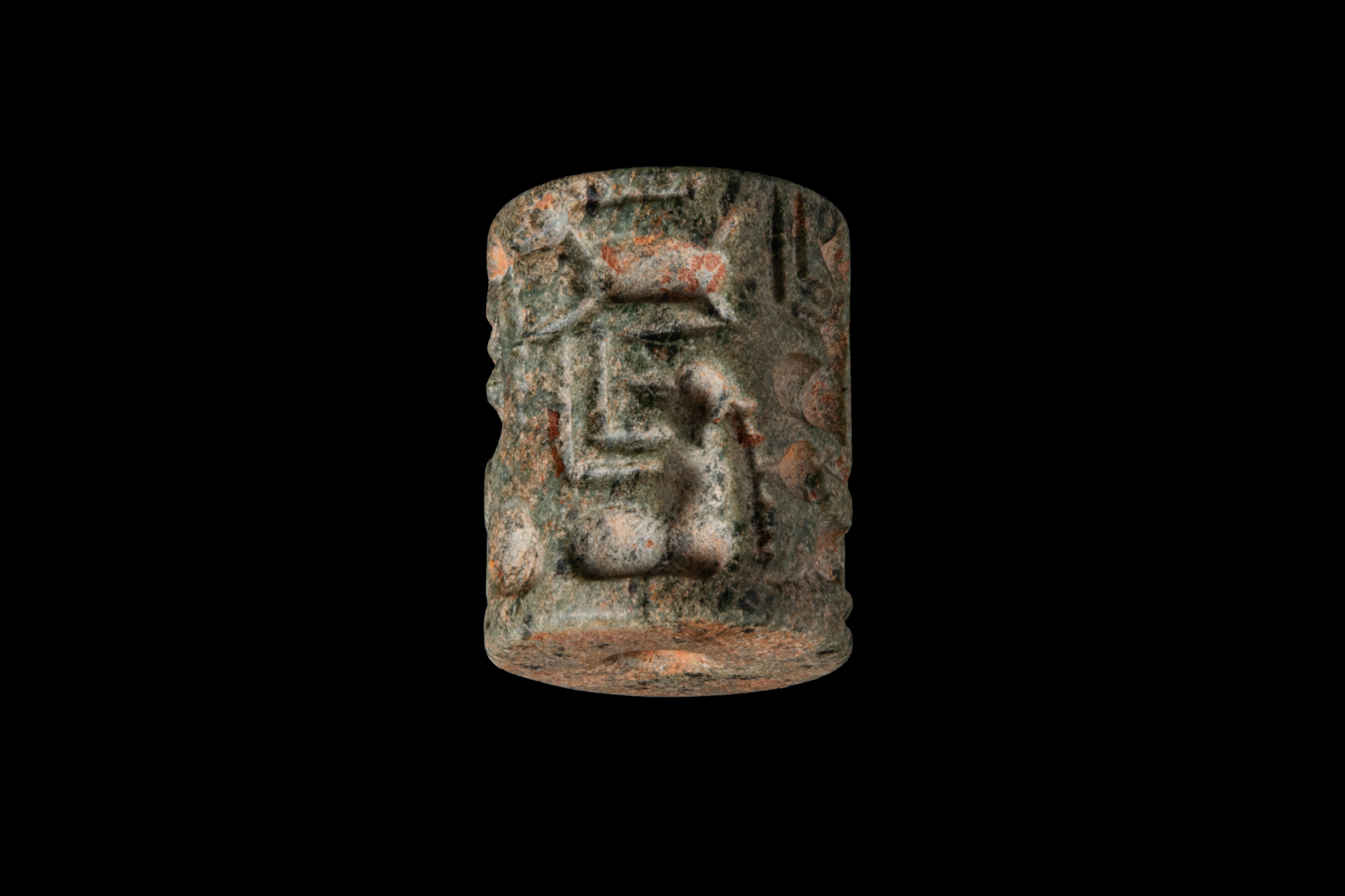 MESOPOTAMIAN GREEN STONE CYLINDER SEAL DEPICTING A SEATED FIGURES