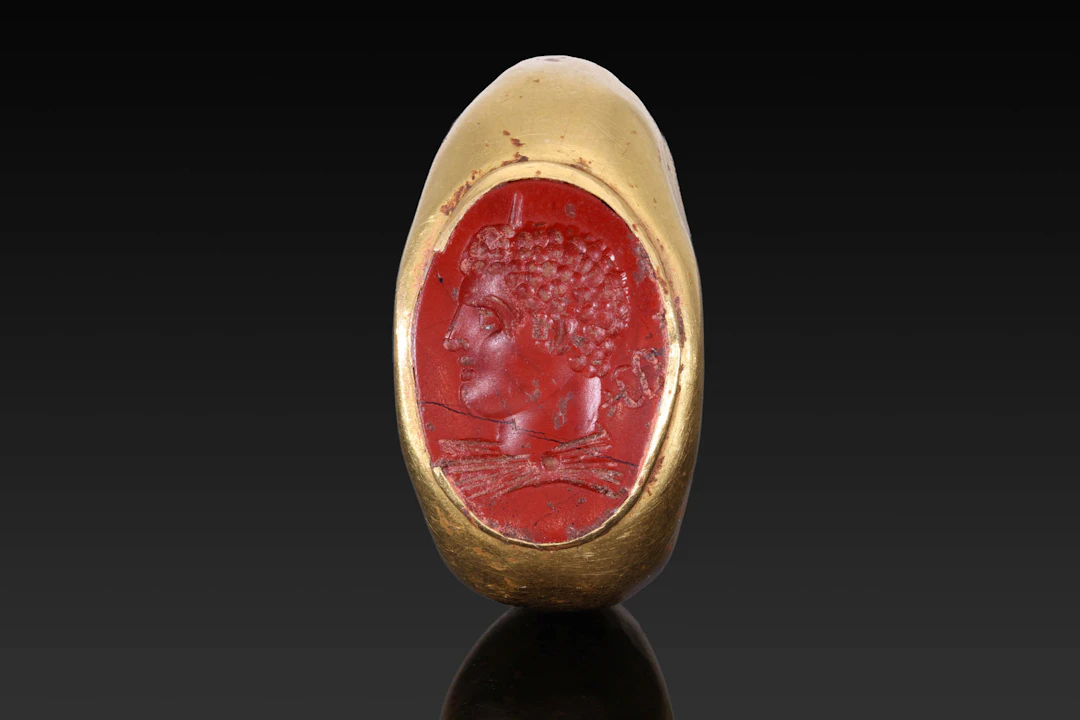 ROMAN GOLD RING WITH RED JASPER INTAGLIO OF A SEVERAN PRINCEPS