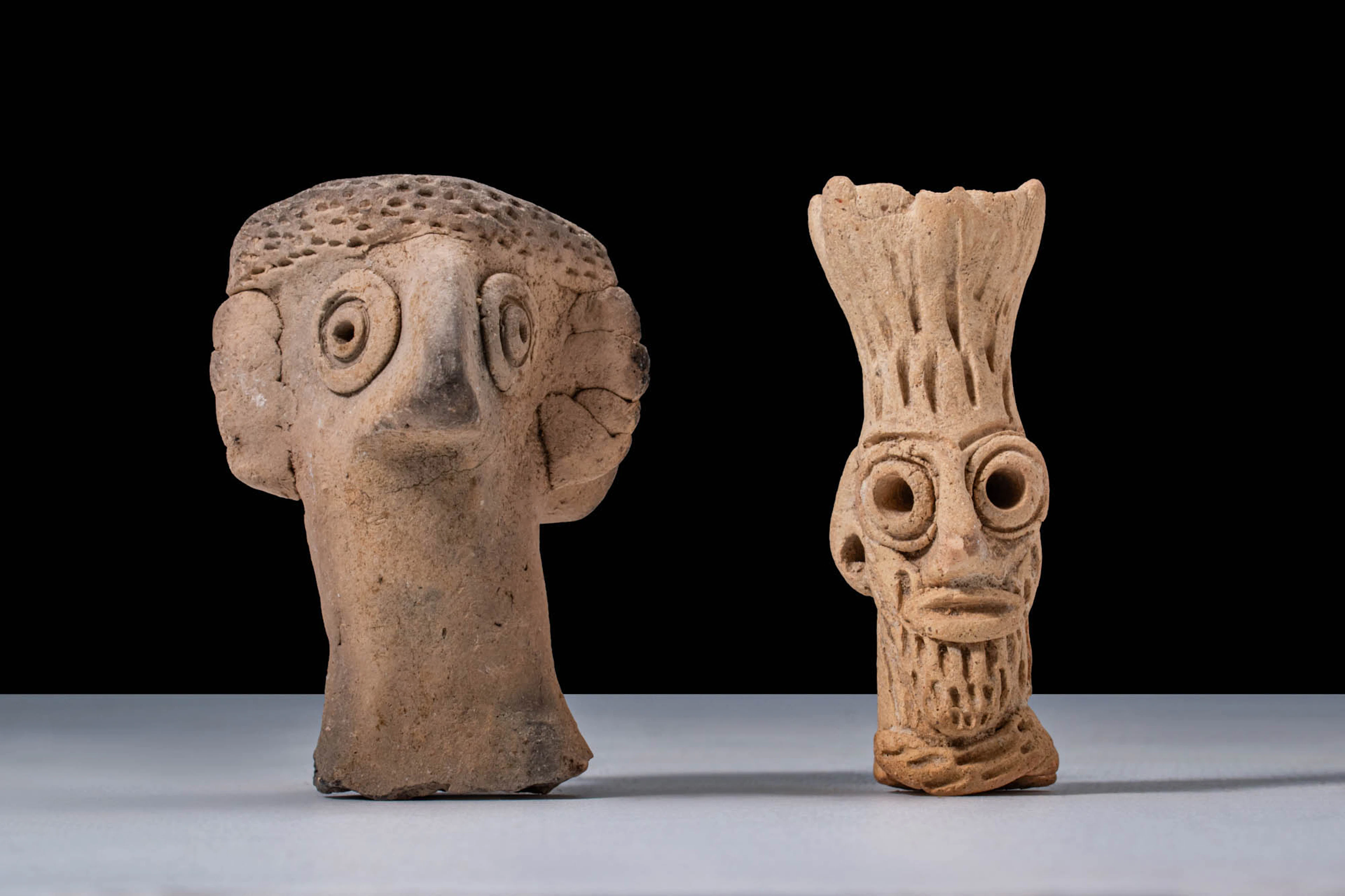 PAIR OF MEDITERRANEAN TERRACOTTA IDOLS