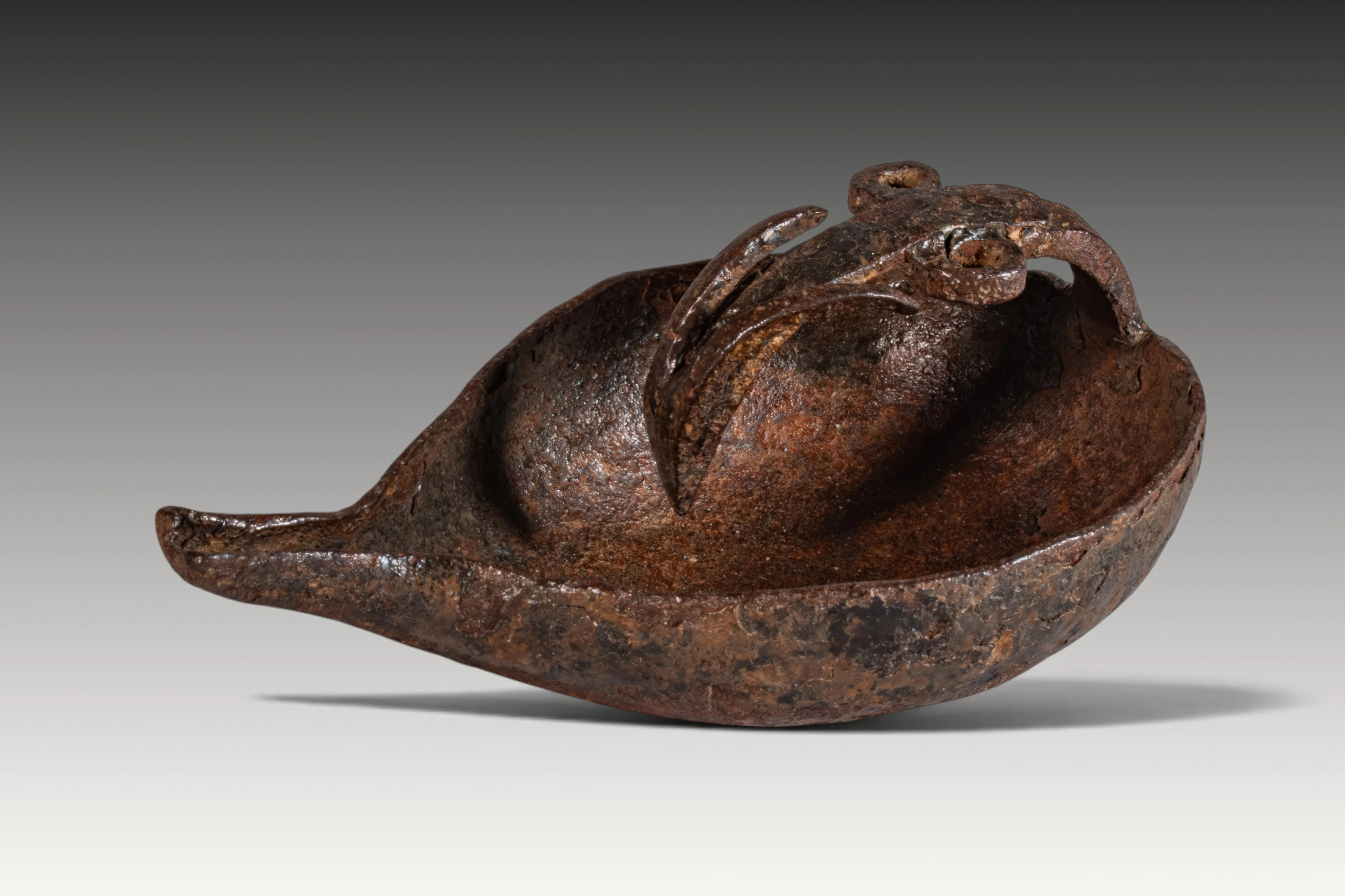LA TENE IRON OIL LAMP WITH ANIMAL-SHAPED HANDLE