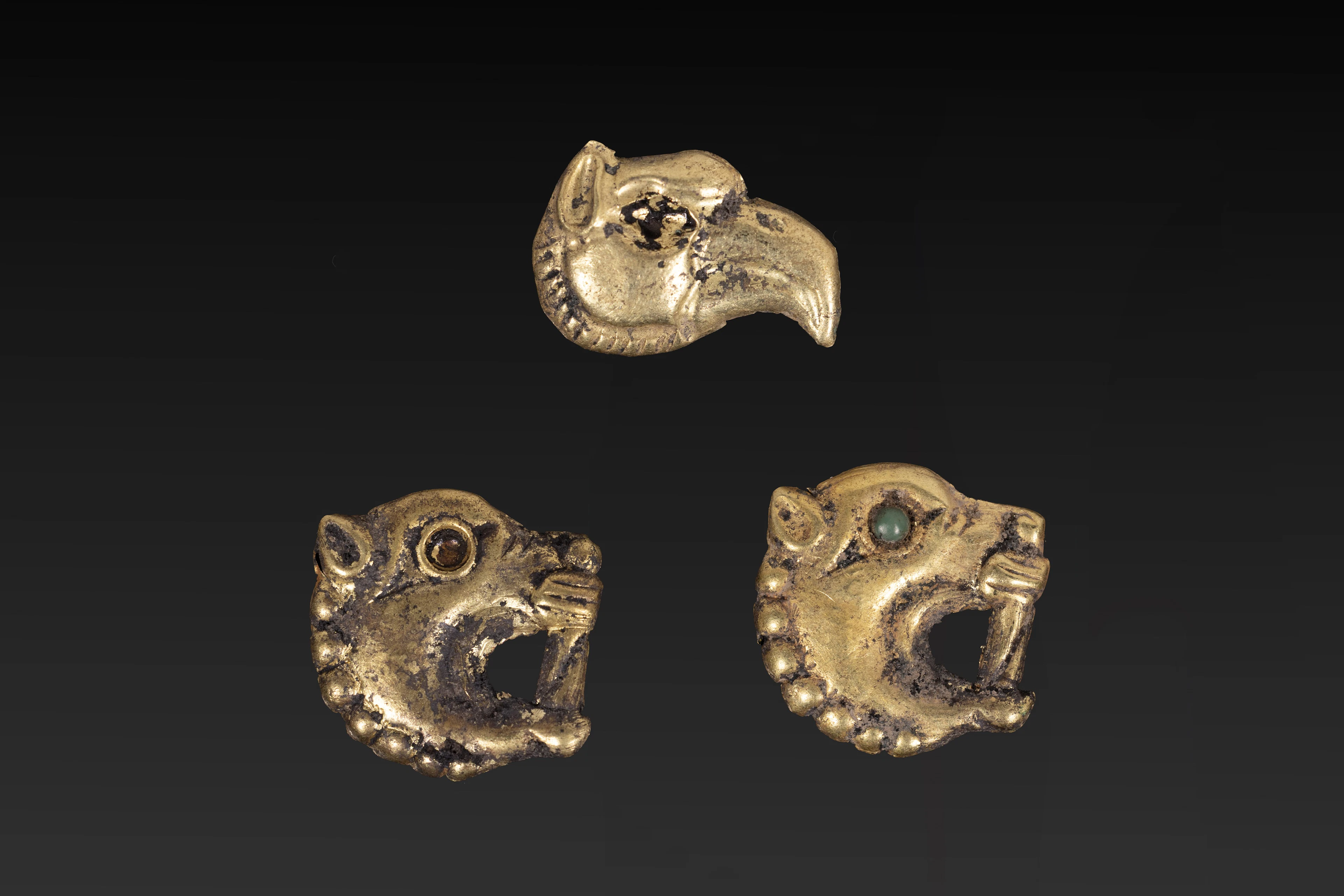 COLLECTION OF SCYTHIAN GOLD ANIMAL-HEAD APPLIQUES