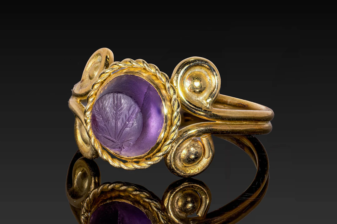 ROMAN AMETHYST INTAGLIO OF THREE STALKS OF WHEAT, A SYMBOL OF CERES