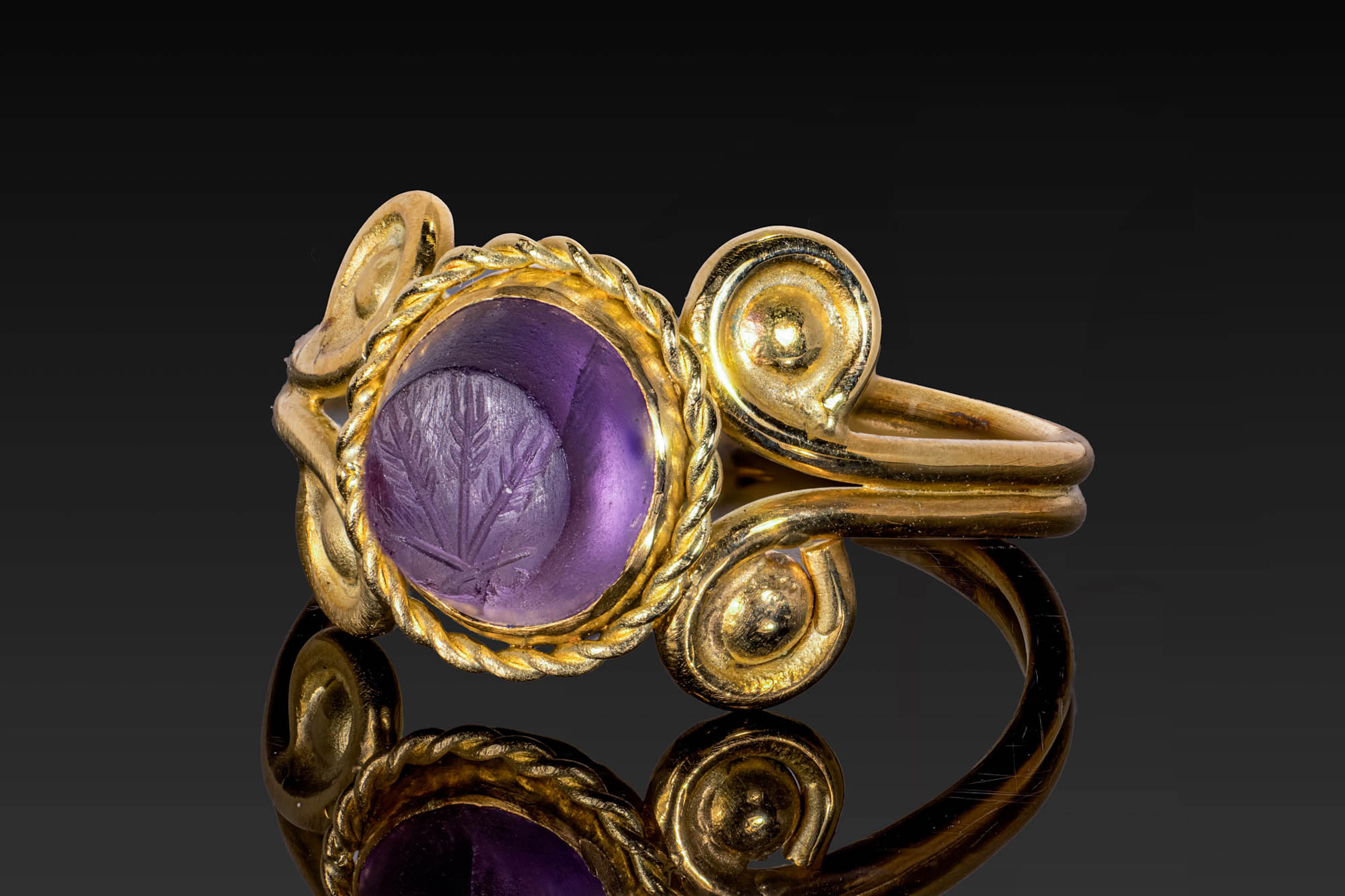 ROMAN AMETHYST INTAGLIO OF THREE STALKS OF WHEAT, A SYMBOL OF CERES