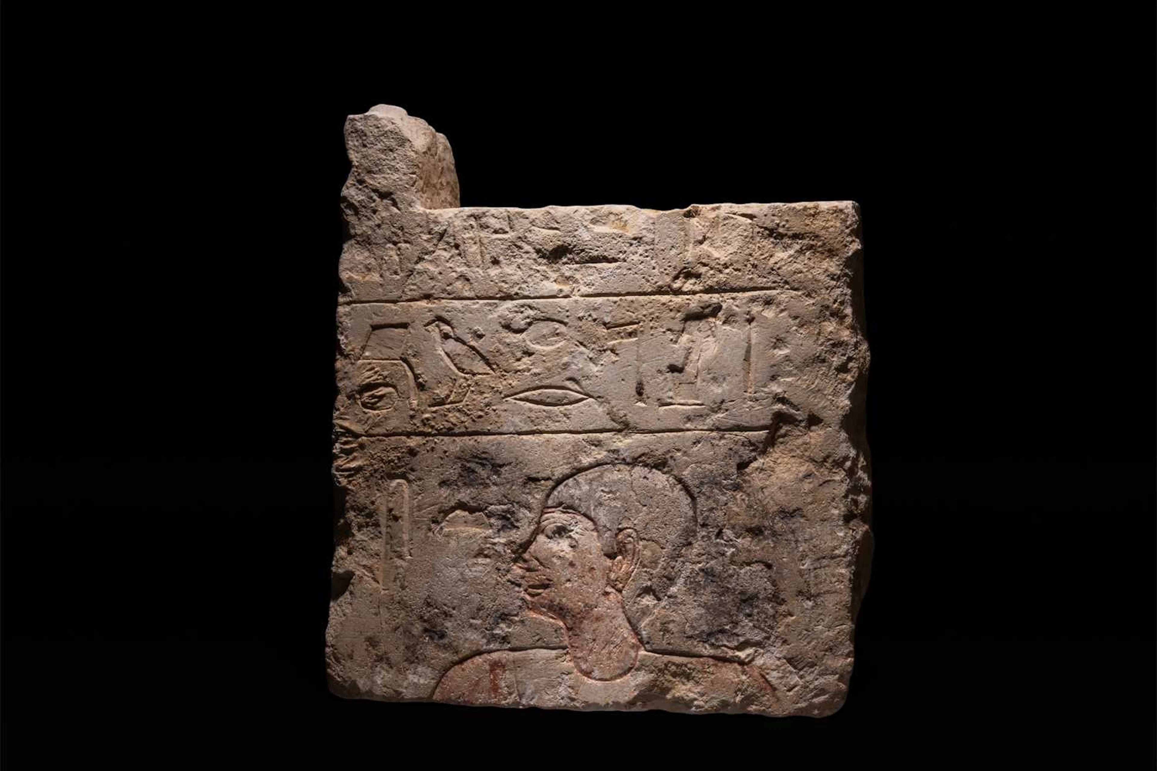 EGYPTIAN LIMESTONE FUNERARY WALL RELIEF DEPICTING A MALE FIGURE IN