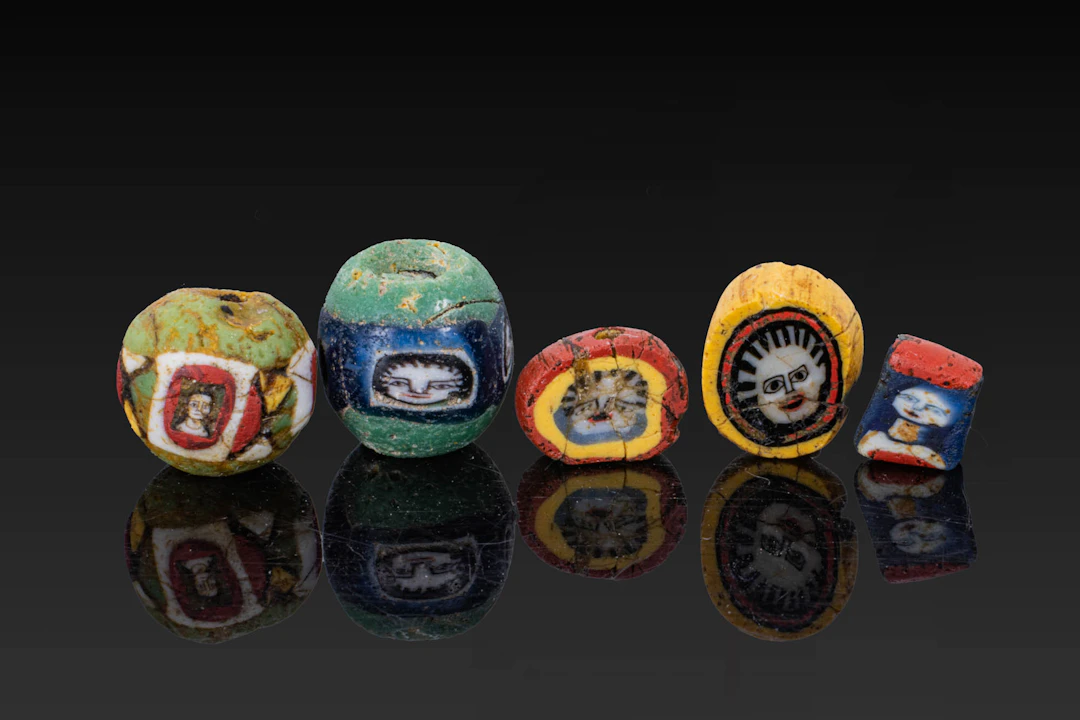 COLLECTION OF ROMAN MOSAIC GLASS BEADS WITH FACES