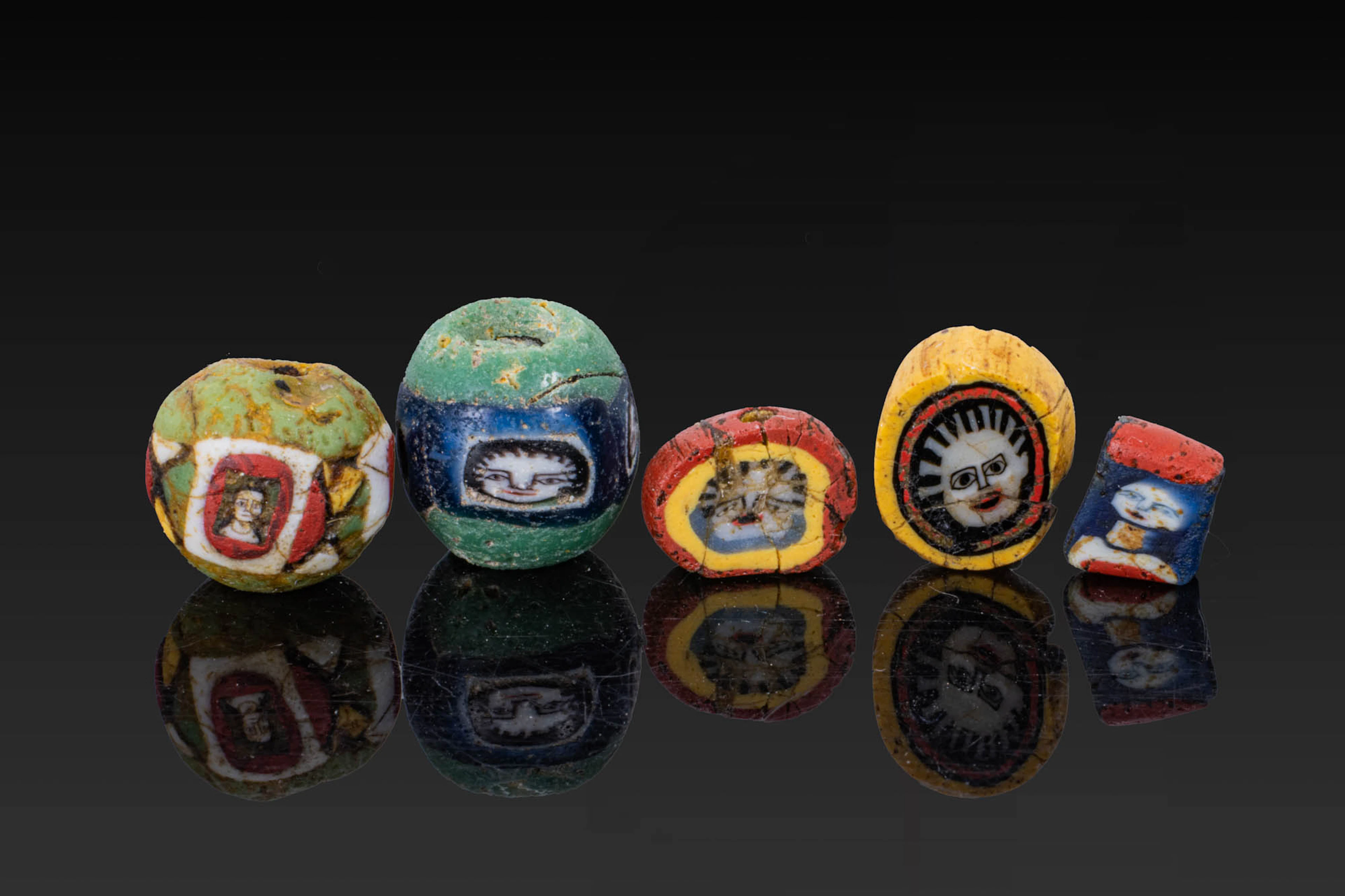 COLLECTION OF ROMAN MOSAIC GLASS BEADS WITH FACES