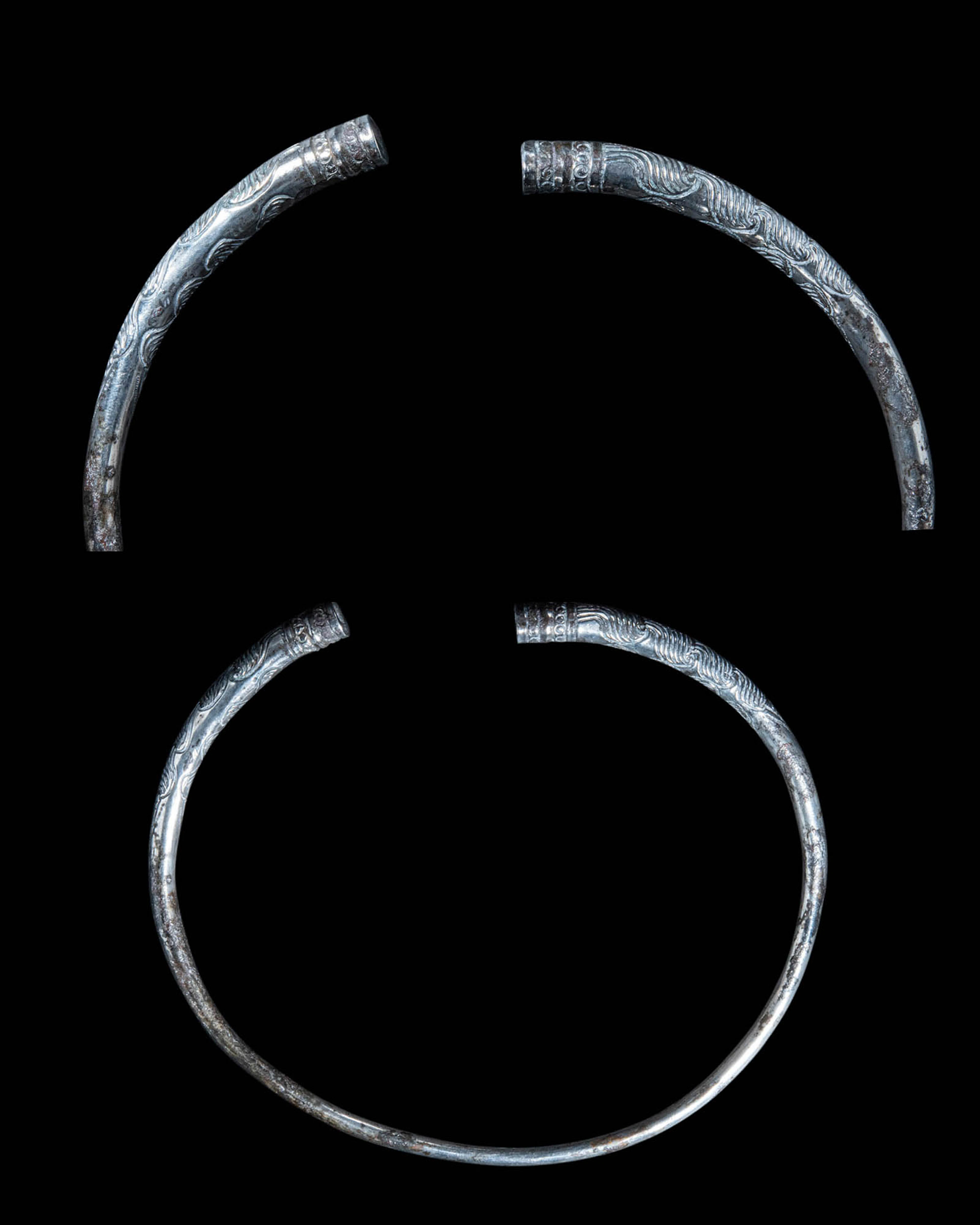 WESTERN ASIATIC OR PARTHIAN SILVER TORC WITH GEOMETRIC MOTIFS