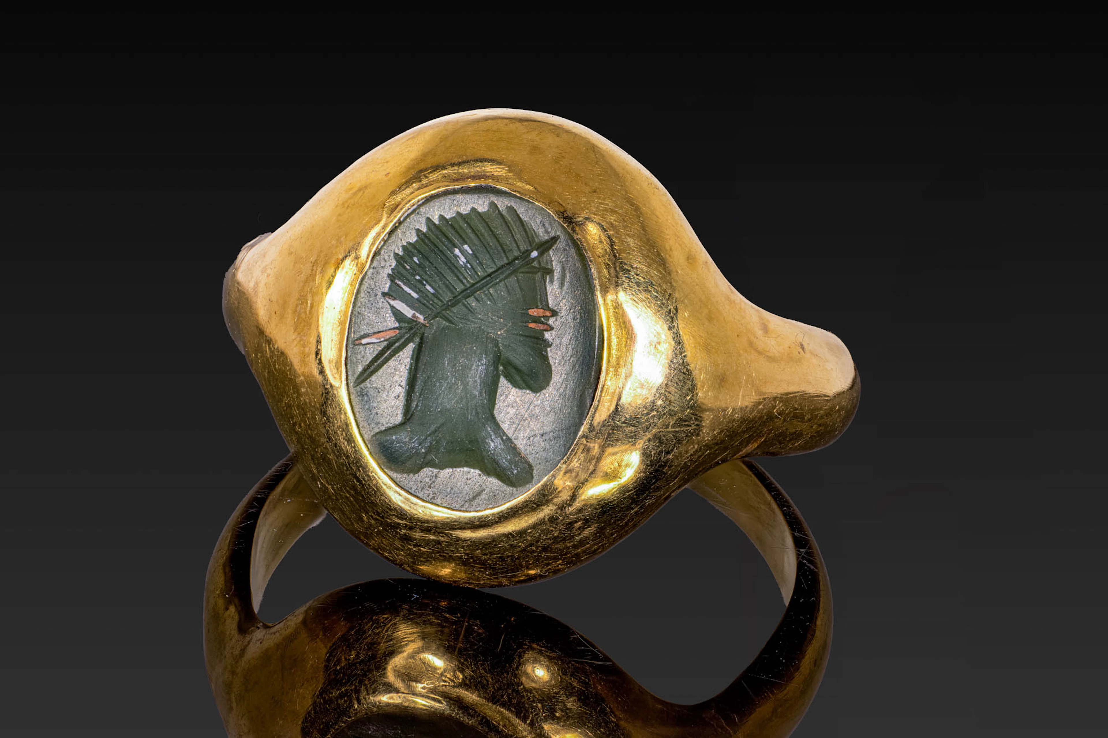 ROMAN GREEN CHALCEDONY INTAGLIO OF A GOD IN GOLD RING