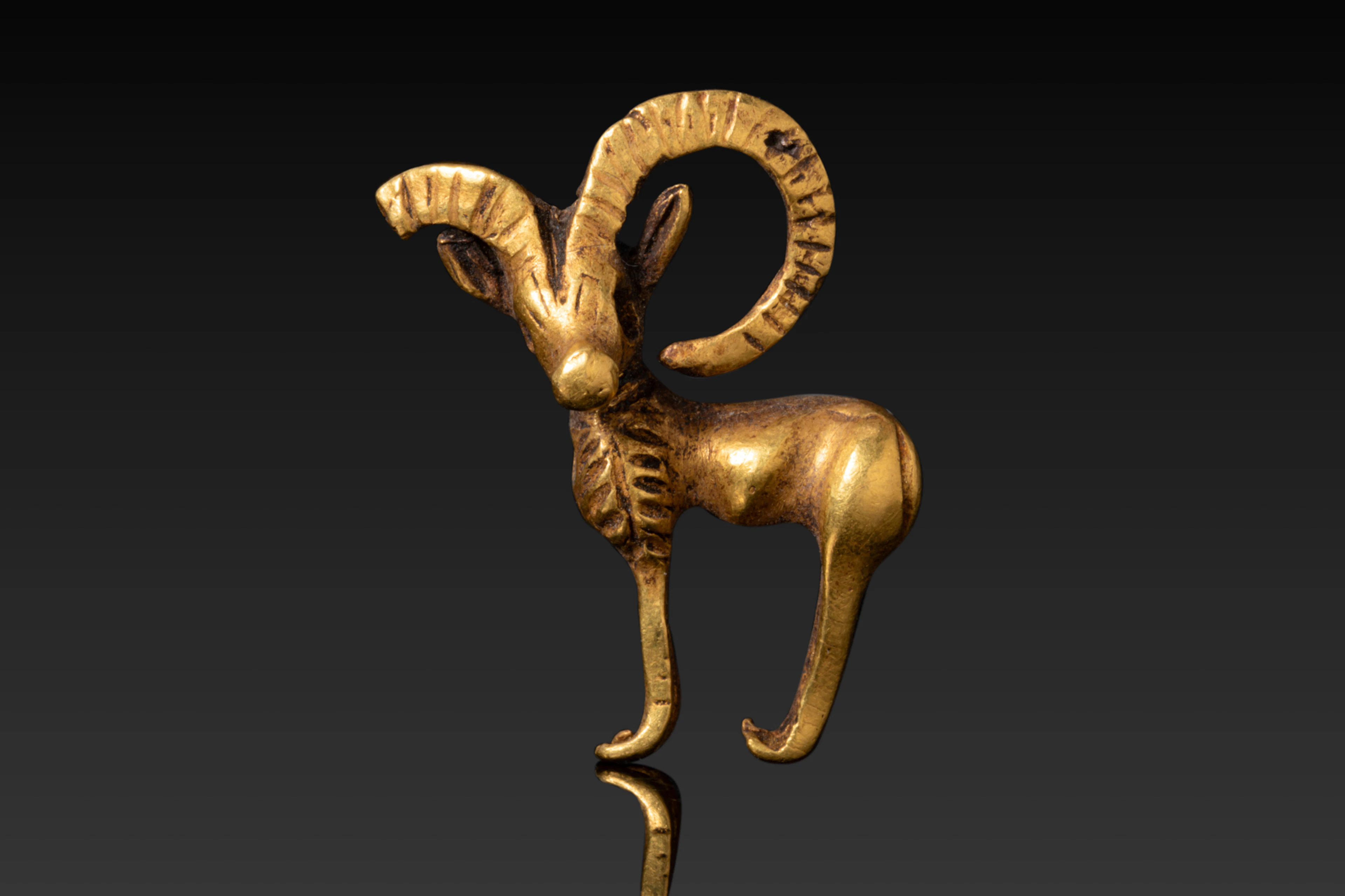 BACTRIAN HIGH KARAT GOLD FIGURINE OF AN IBEX