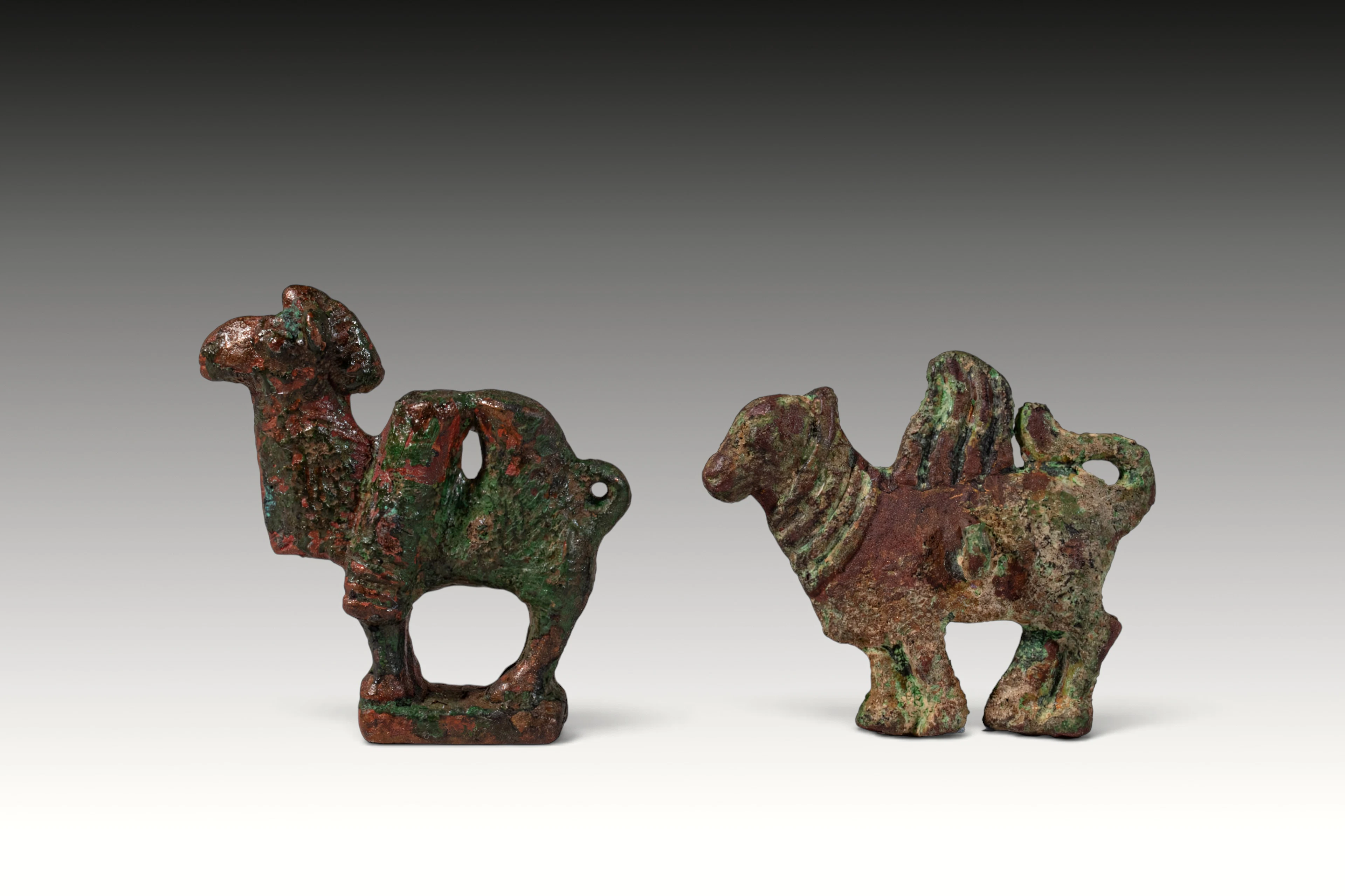 PAIR OF SOUTH ARABIAN BRONZE CAMEL-SHAPED SEAL PENDANTS