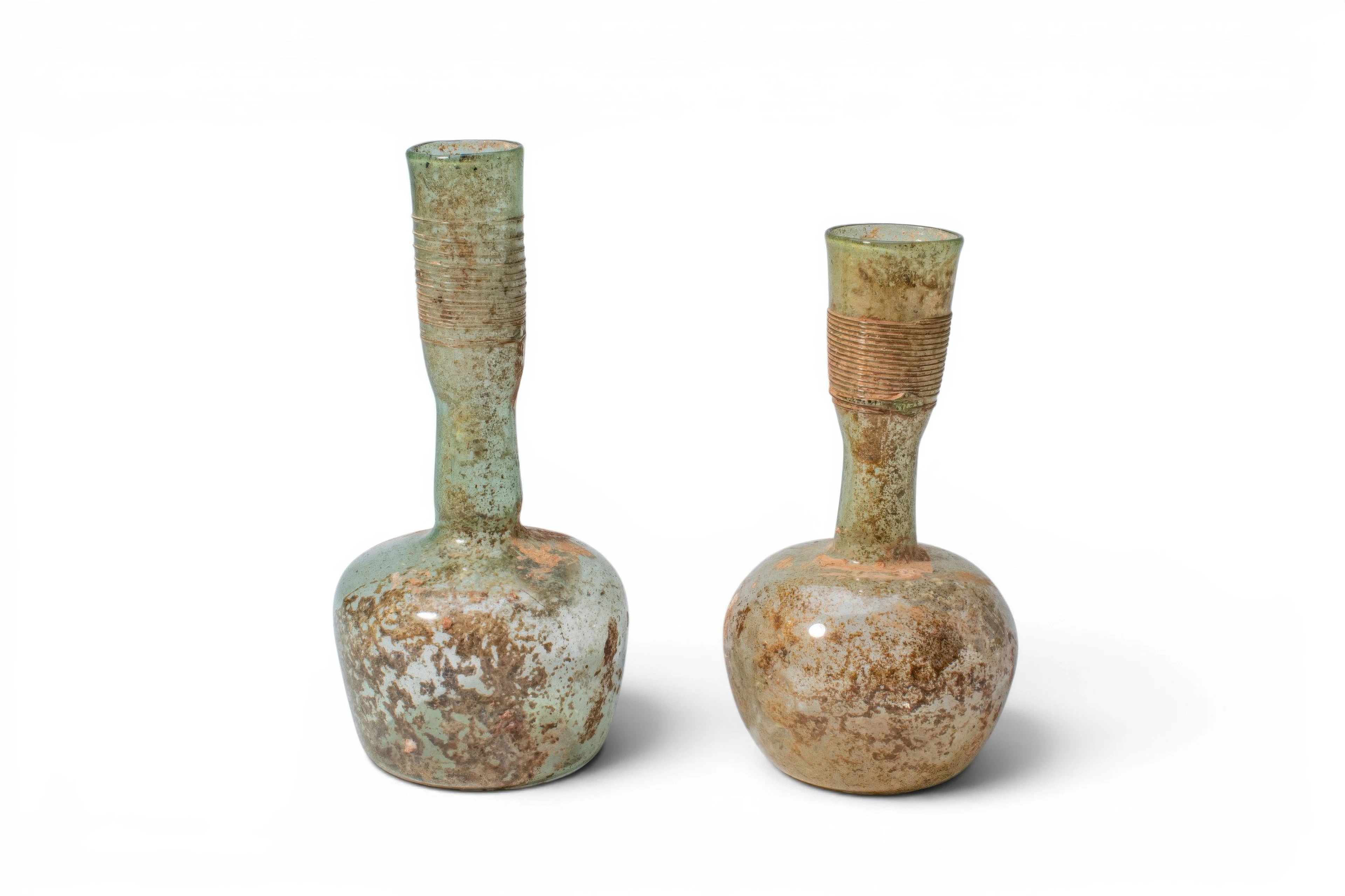 PAIR OF ROMAN GLASS UNGUENTARIA WITH APPLIED GLASS THREAD DECORATION