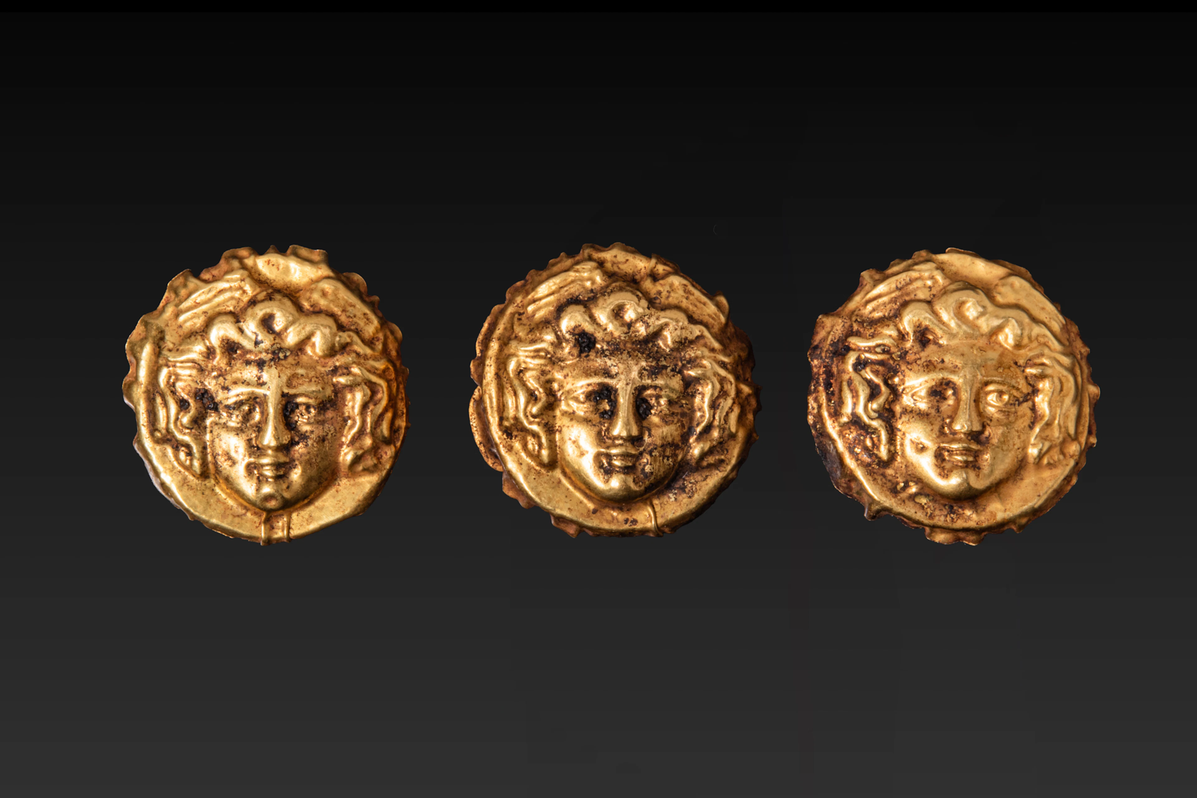 SET OF RARE GREEK HIGH KARAT GOLD GORGONEION APPLIQU�S