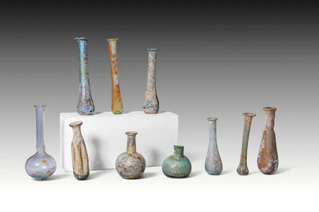 LARGE COLLECTION OF TEN ROMAN GLASS UNGUENTARIA