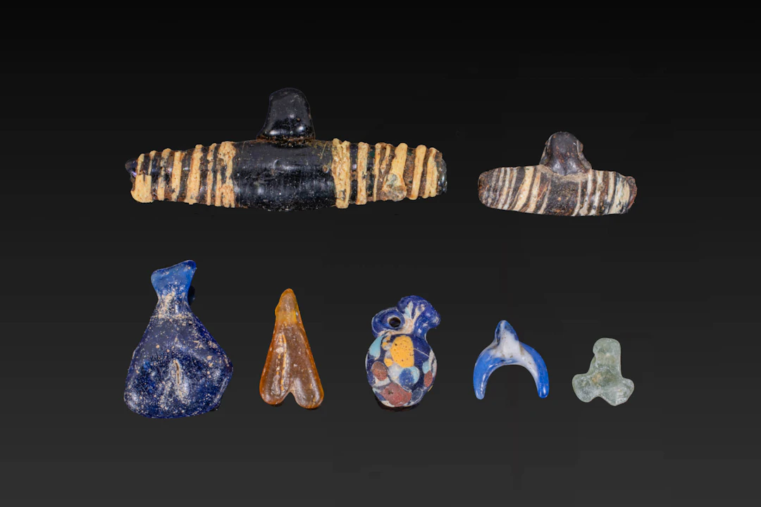 COLLECTION OF GREEK GLASS BEADS AND PENDANTS
