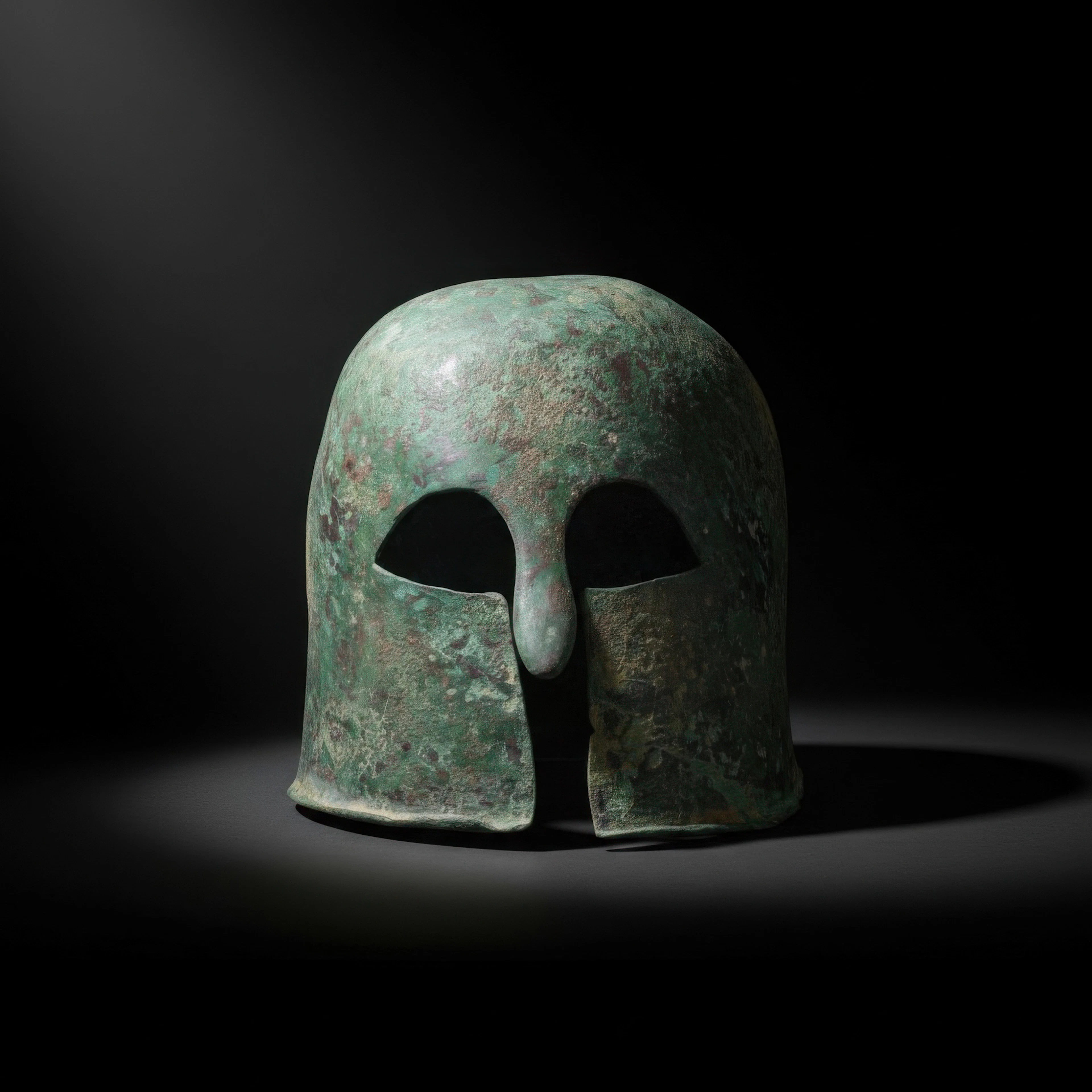 EARLY GREEK CORINTHIAN BRONZE HELMET