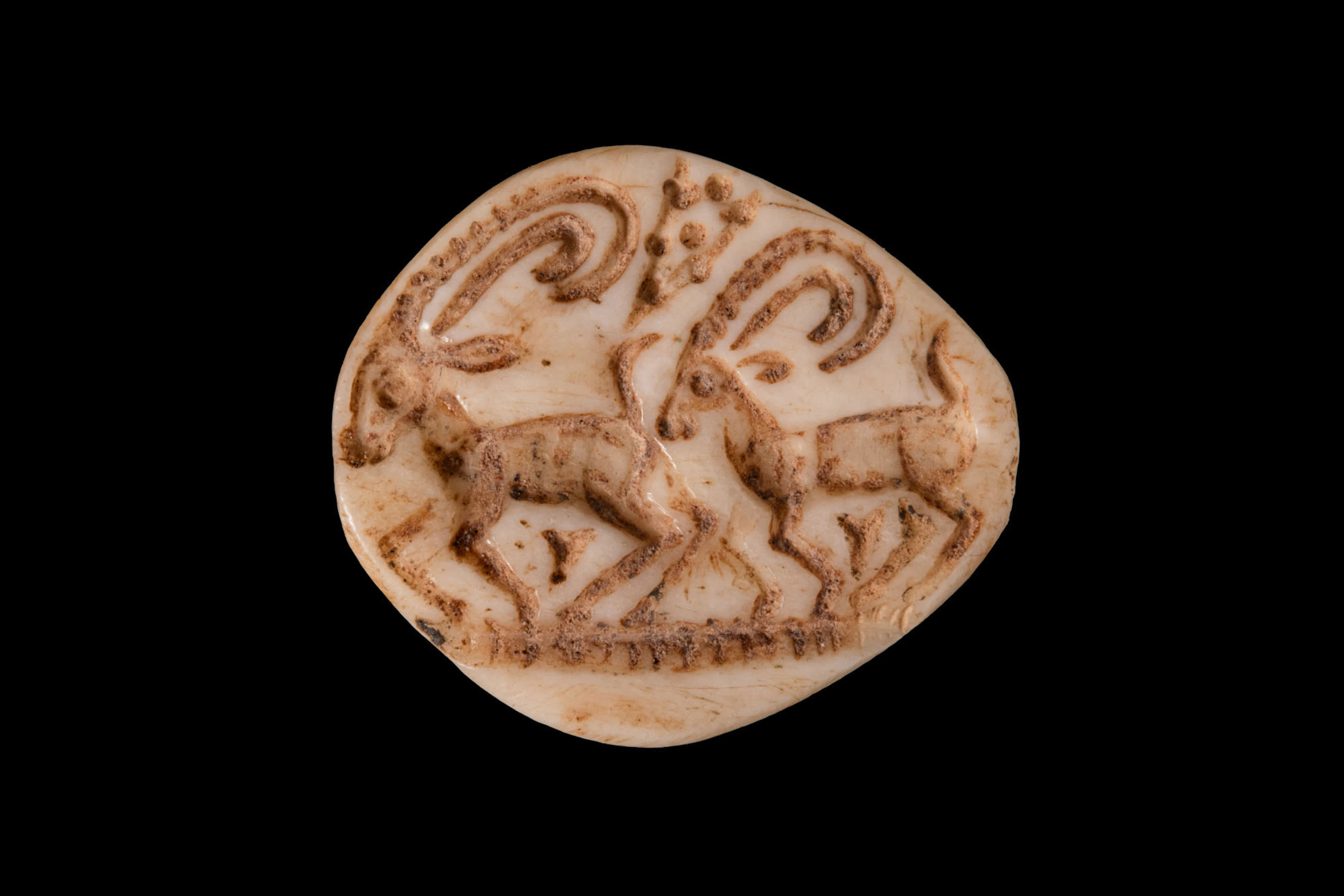 NORTHEN SYRIAN ALABASTER SEAL WITH GAZELLES AND FLORAL MOTIF