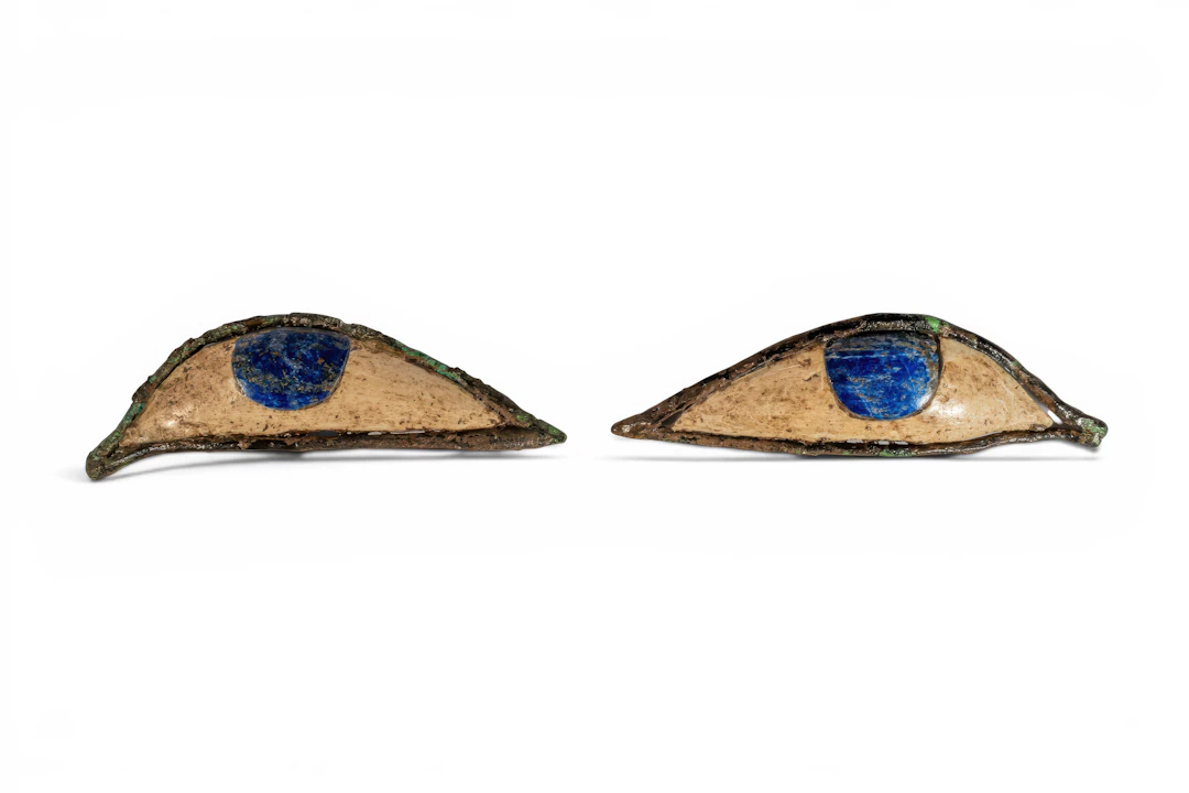 PAIR OF EGYPTIAN BRONZE, STONE AND LAPIS LAZULI SARCOPHAGUS EYES