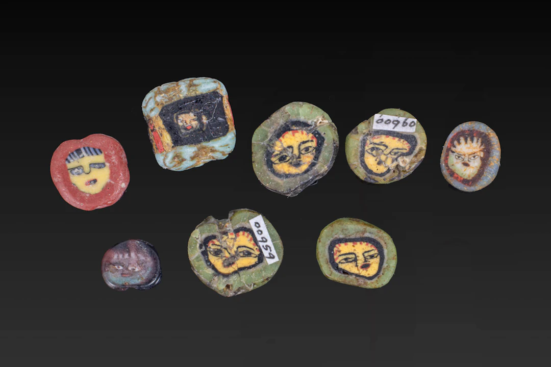 COLLECTION OF ROMAN MOSAIC GLASS BEADS WITH FACES