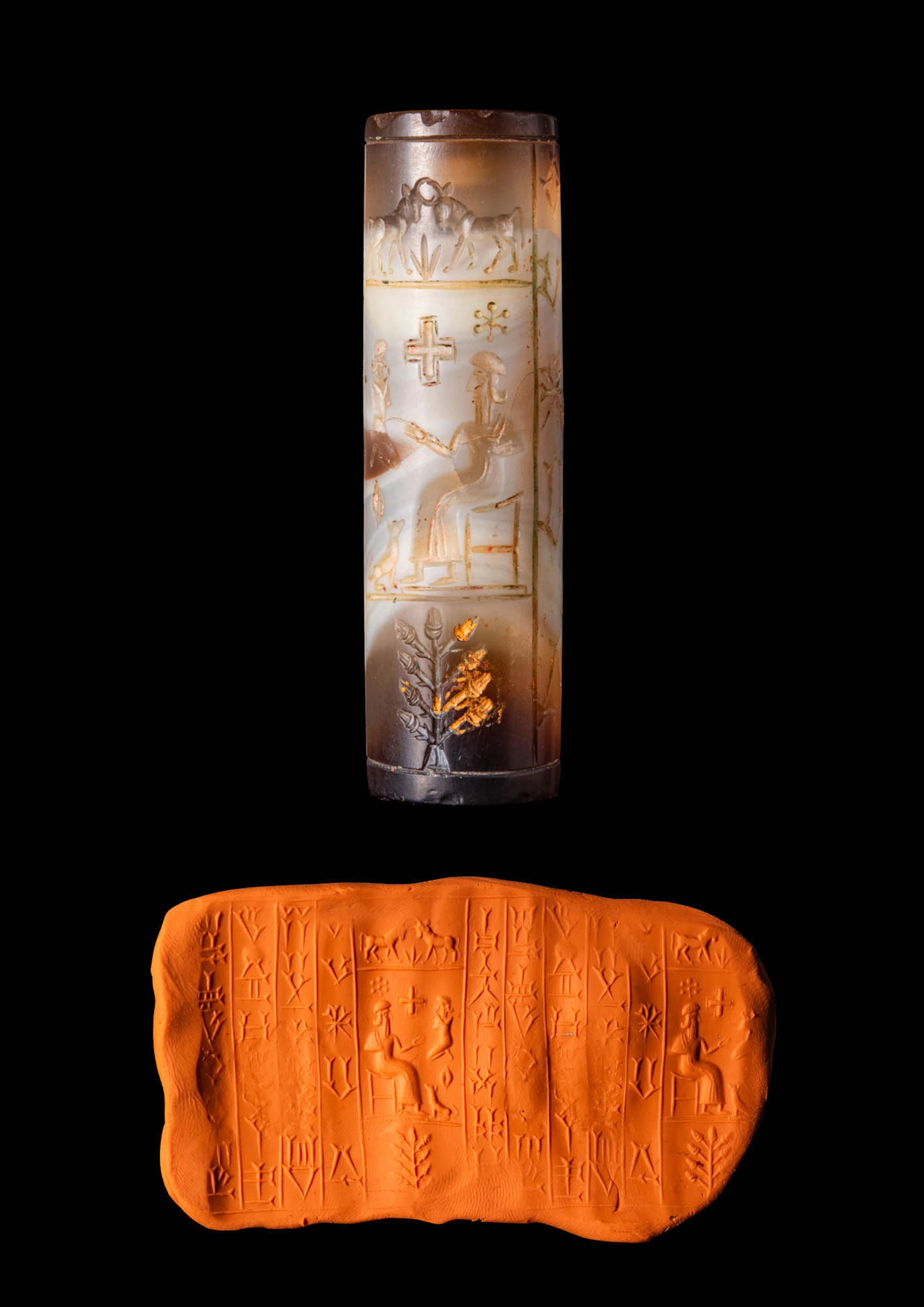 KASSITE BANDED AGATE CYLINDER SEAL WITH DEITY AND WORSHIPPER