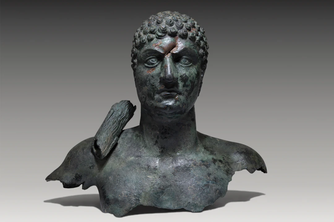 LARGE ROMAN BRONZE BUST OF AN EMPEROR AS HERAKLES WITH CLUB