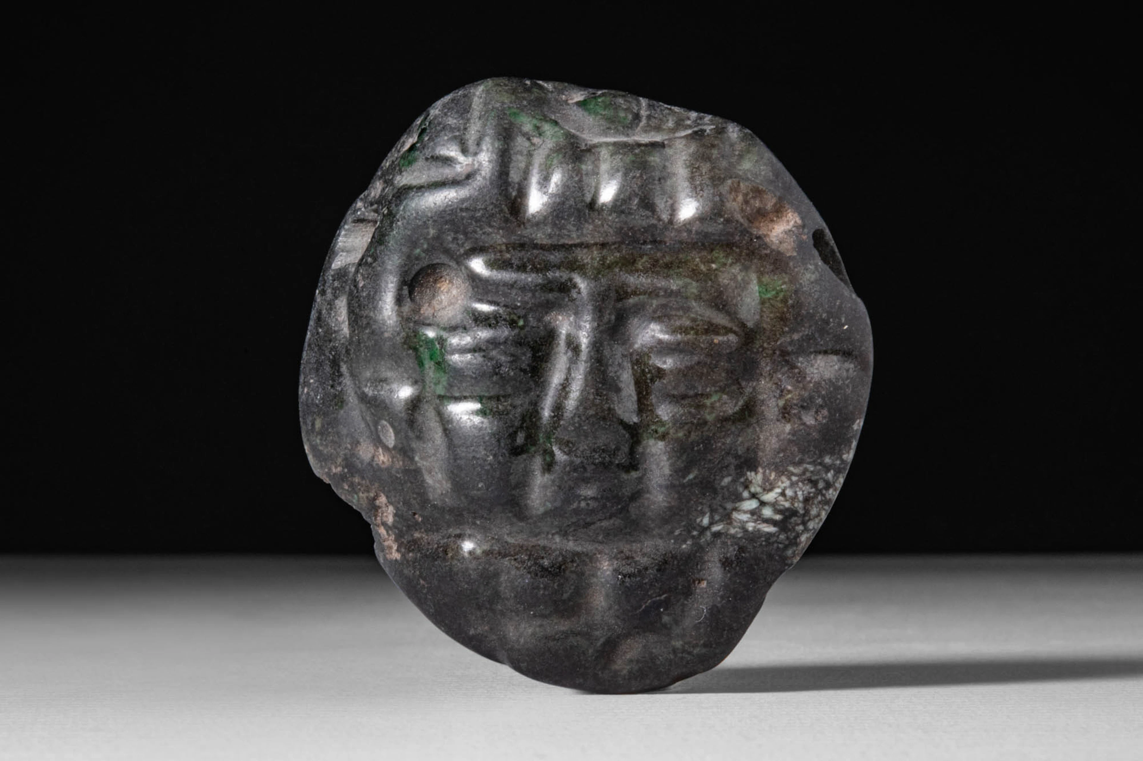 OLMEC HARDSTONE PENDANT IN THE FORM OF A MAN’S HEAD