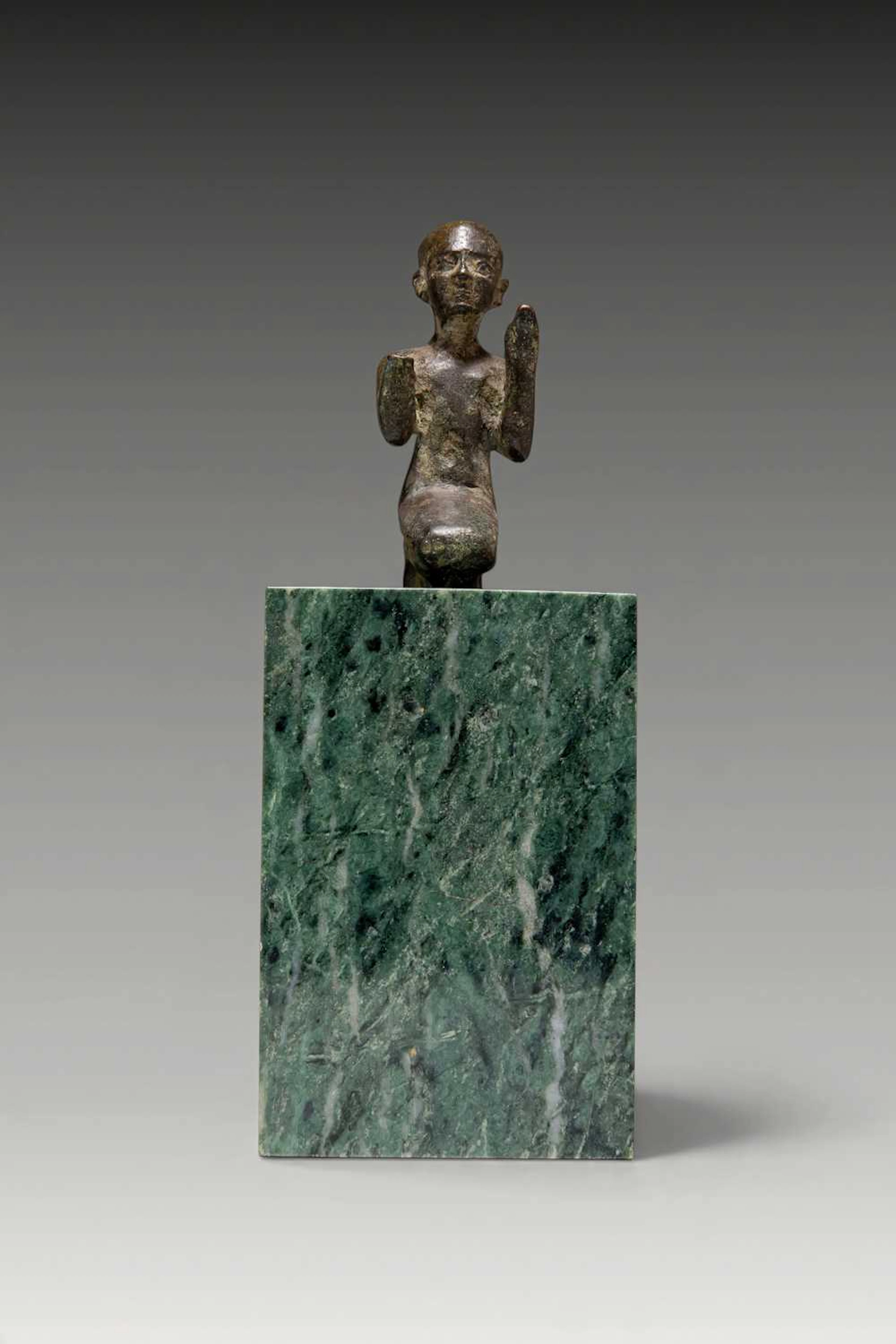 EGYPTIAN BRONZE FIGURINE OF A KNEELING PRIEST