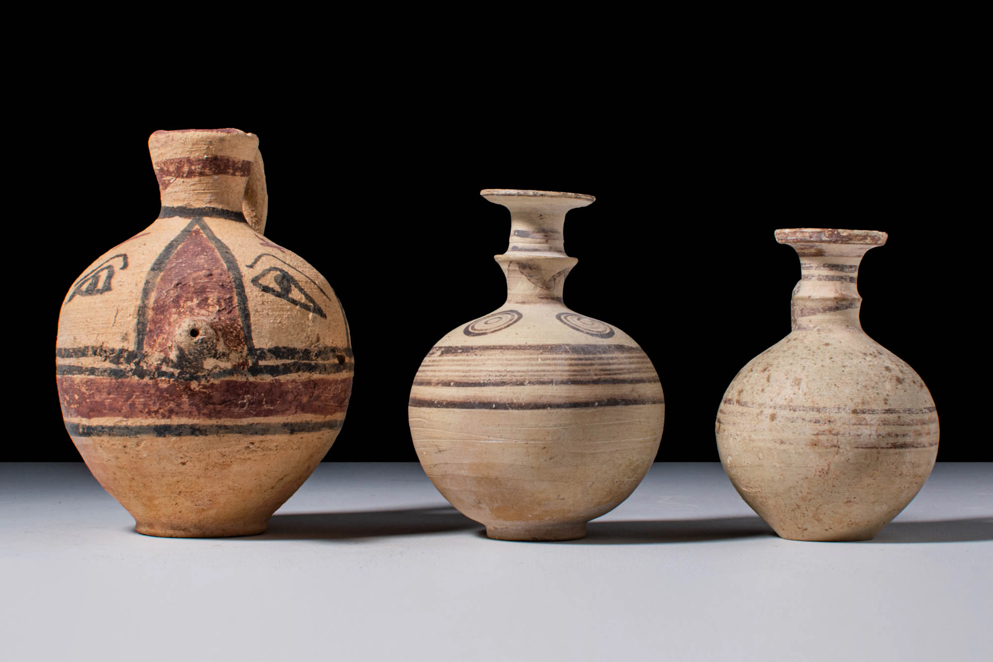 COLLECTION OF CYPRIOT TERRACOTTA JUGS WITH PAINTED DECORATION