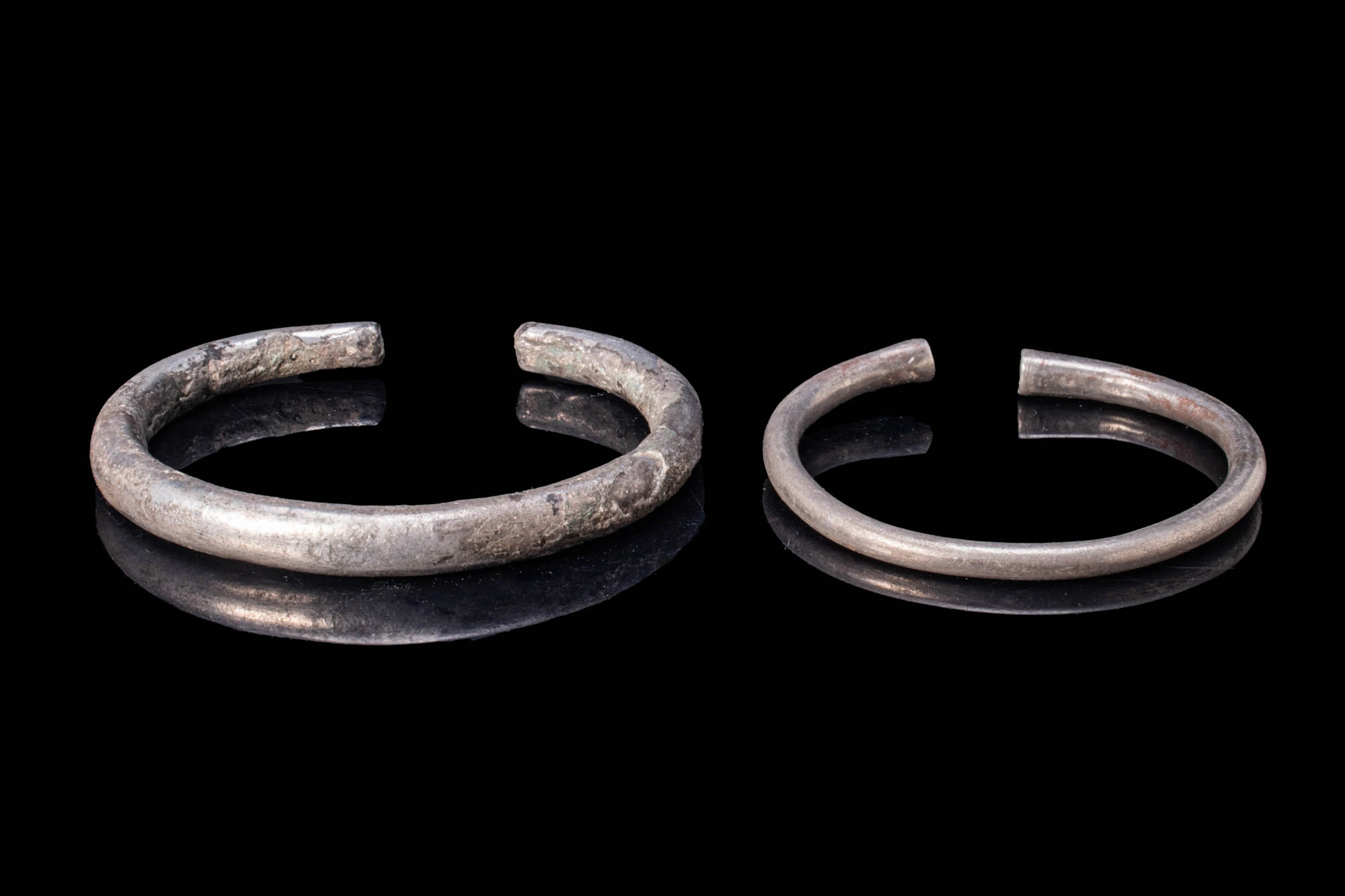 PAIR OF VIKING ERA SILVER PENANNULAR BRACELETS