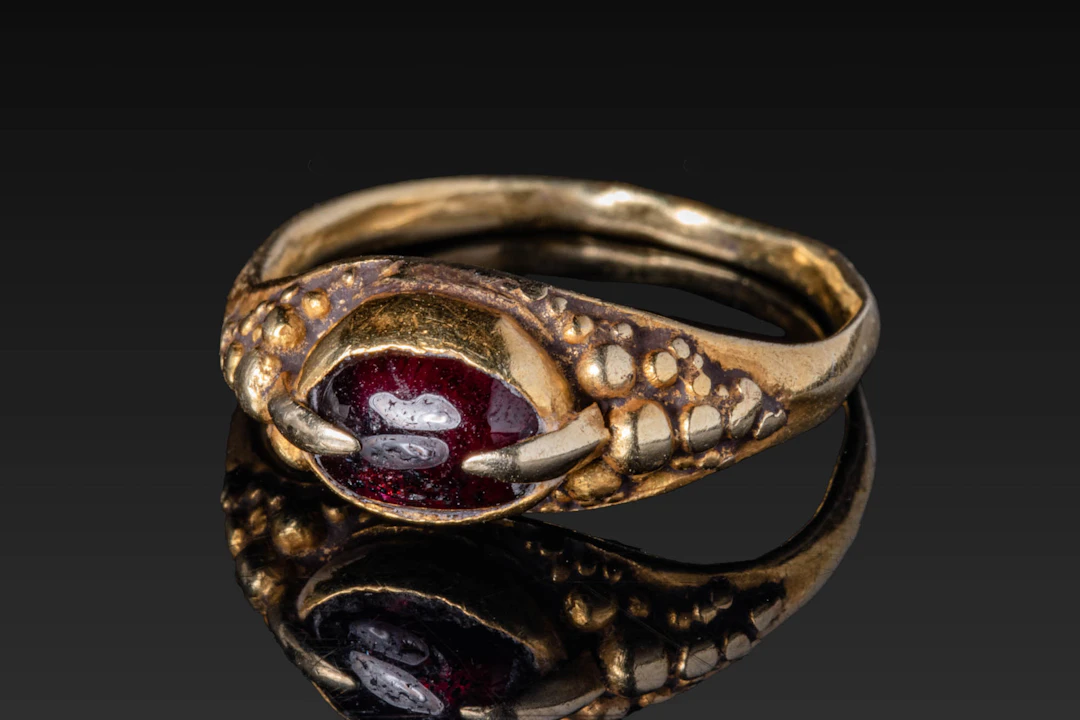 MEDIEVAL HIGH KARAT GOLD RING WITH RED GARNET CABOCHON