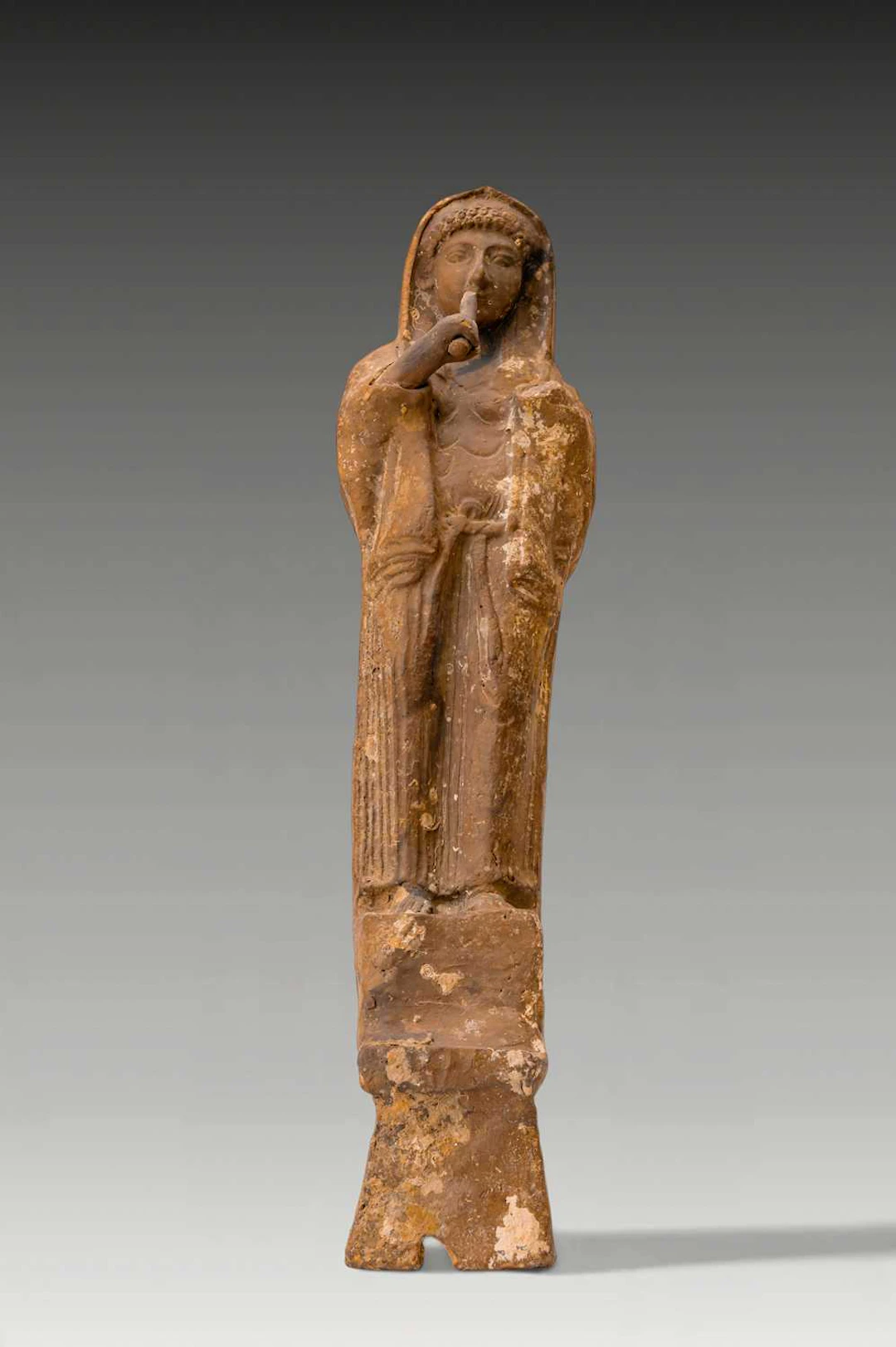 PHOENICIAN TERRACOTTA FEMALE FIGURE PLAYING FLUTE