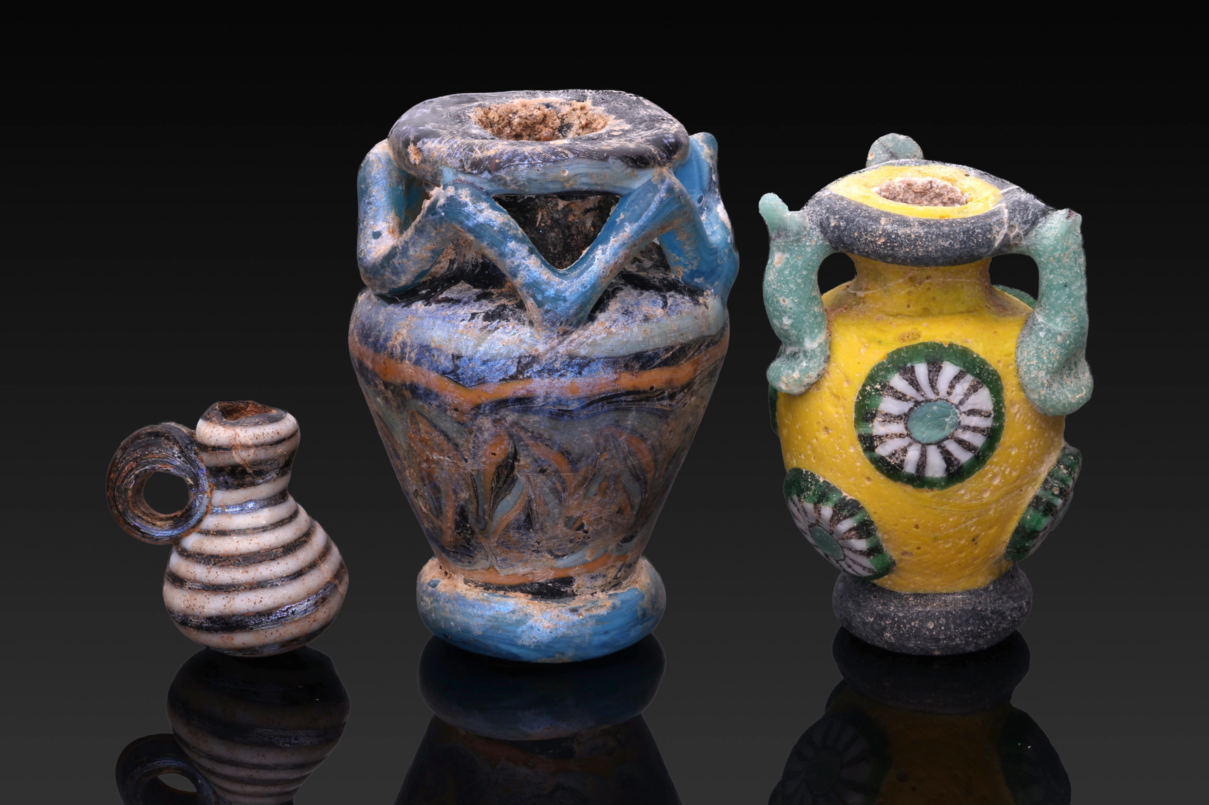 COLLECTION OF STUNNING ROMAN GLASS VESSEL-SHAPED BEADS