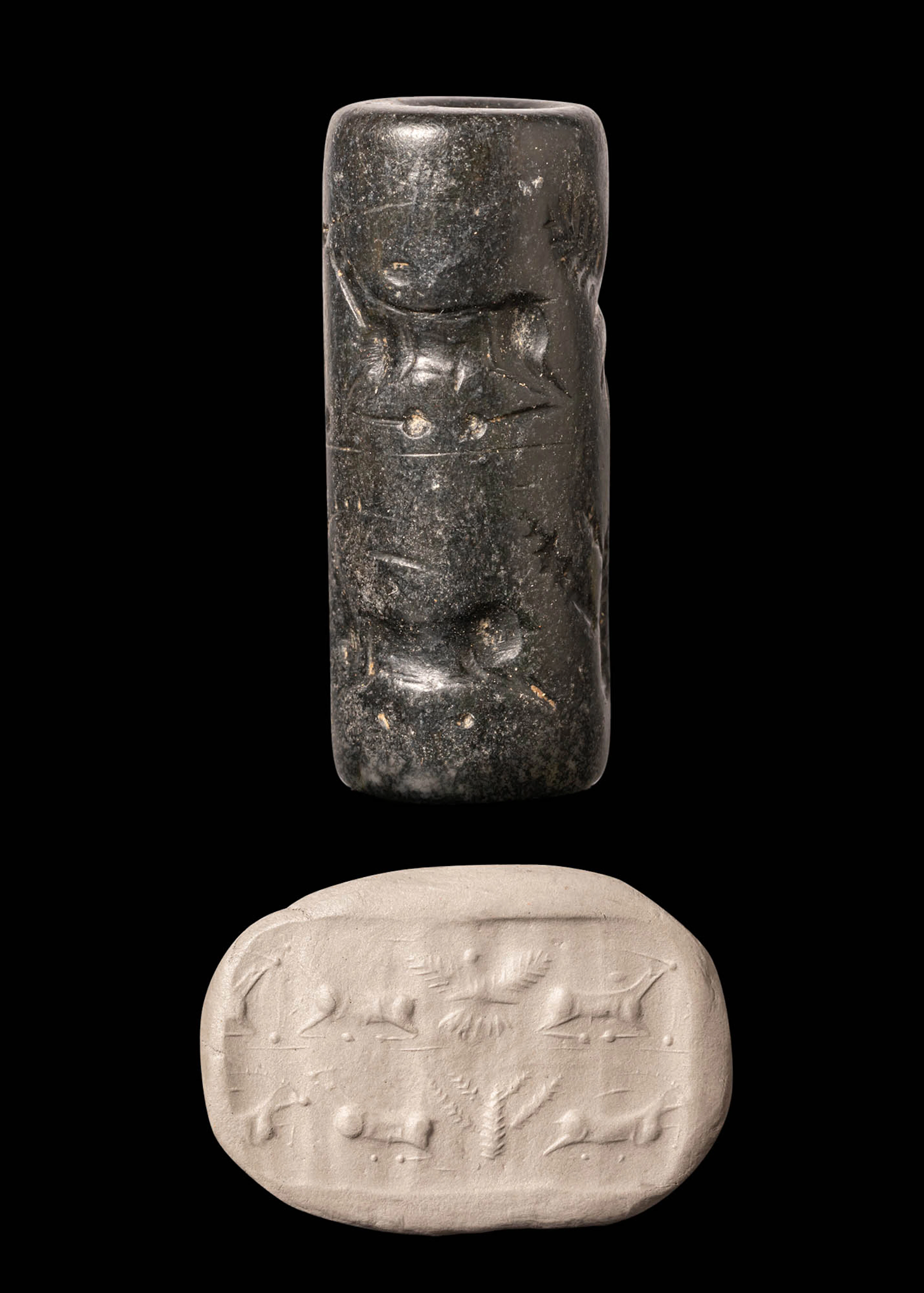 JEMDET NASR HEMATITE CYLINDER SEAL WITH TWO REGISTERS OF STAGS