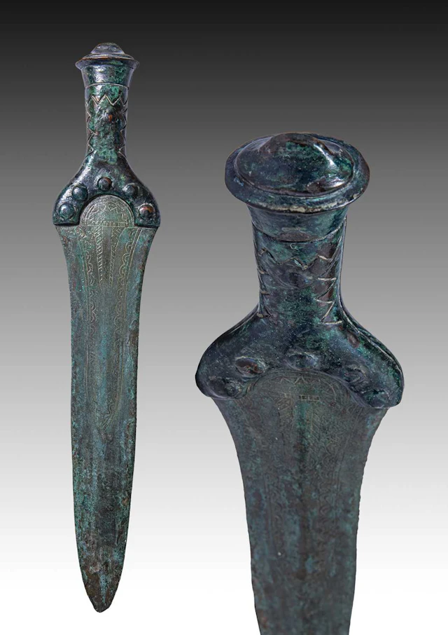 BRONZE AGE SWORD WITH DECORATED HILT