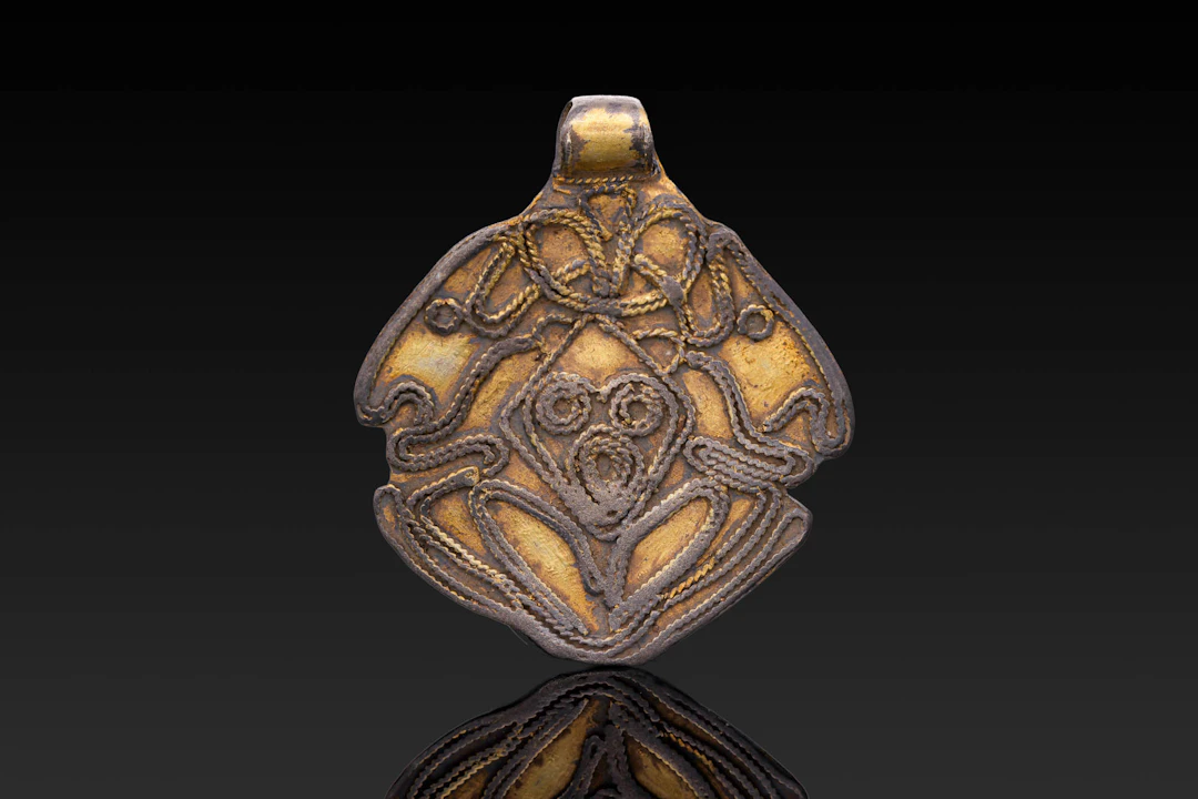 VIKING SILVER-GILT PENDANT WITH ODIN