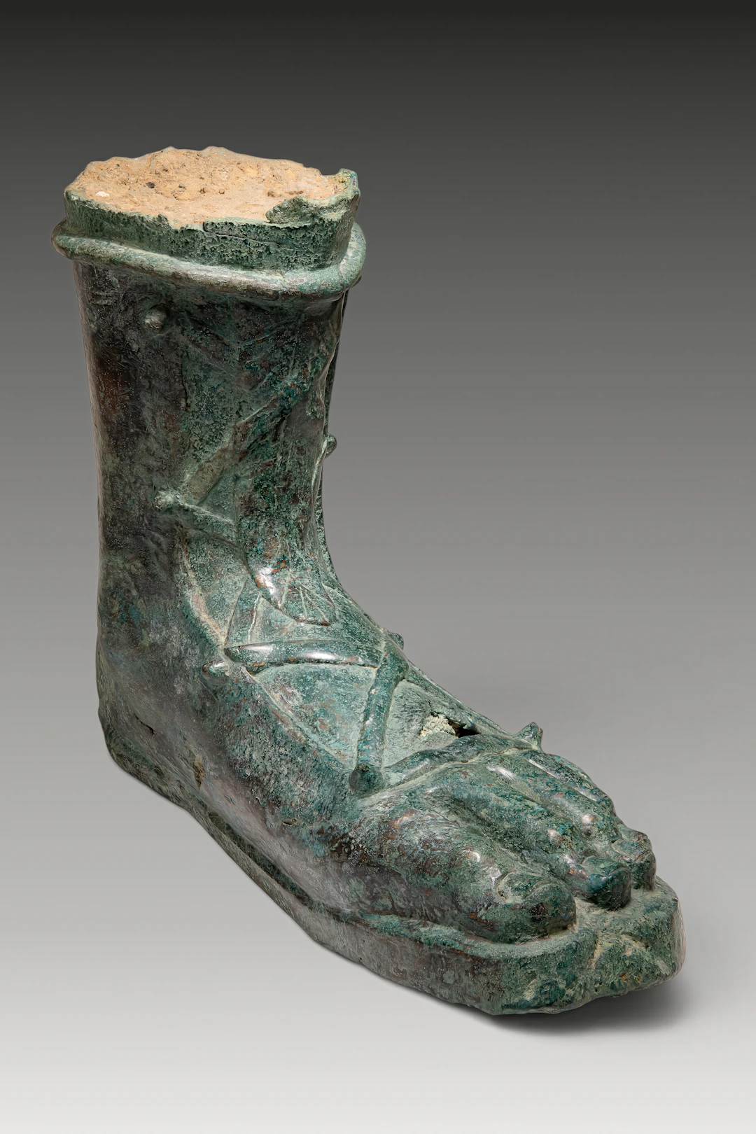 LIFE-SIZE ROMAN BRONZE FOOT FROM A STATUE OF AN EMPEROR OR GENERAL